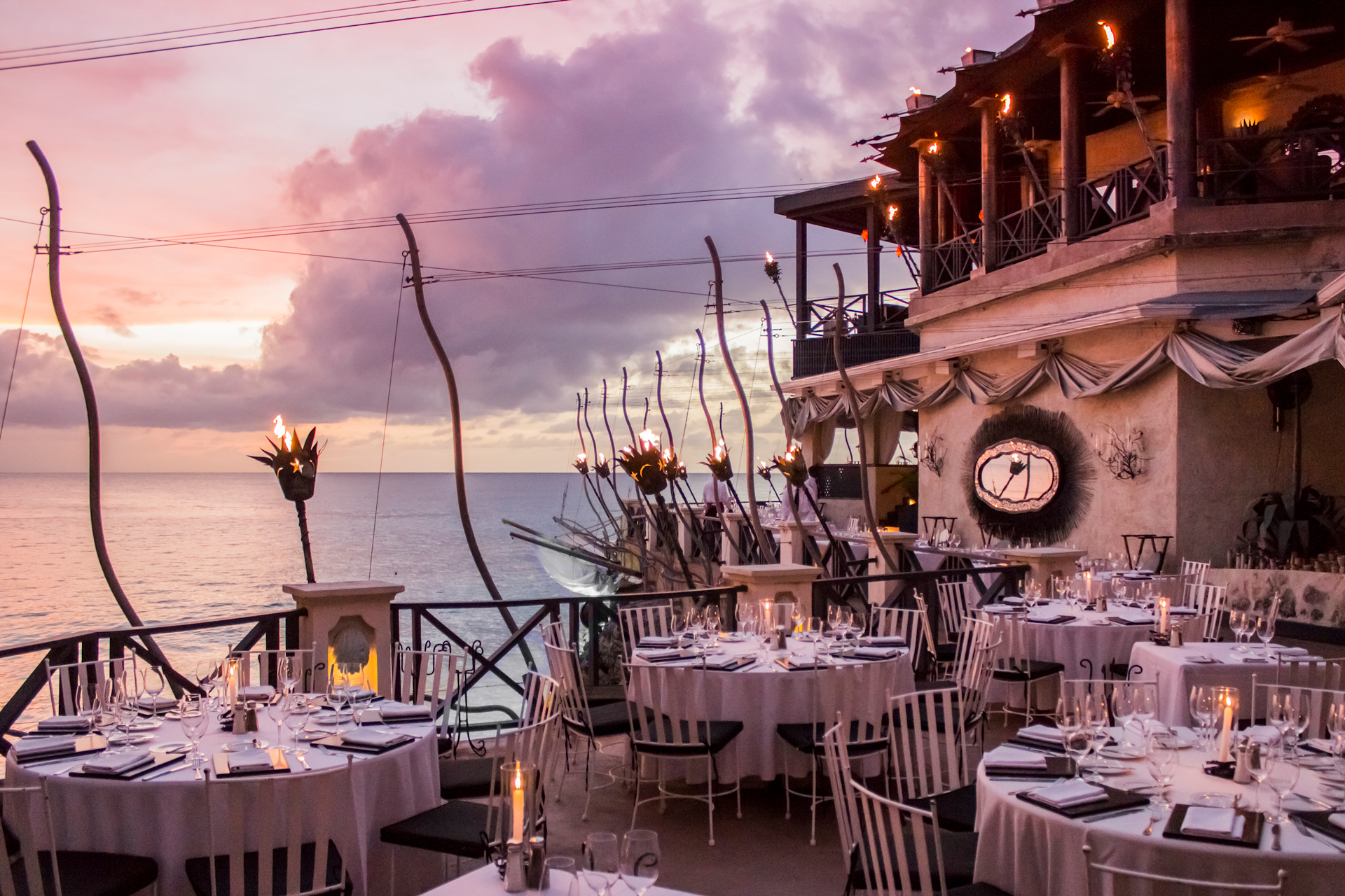 The sun setting on The Cliff Terrace outdoor balcony dining