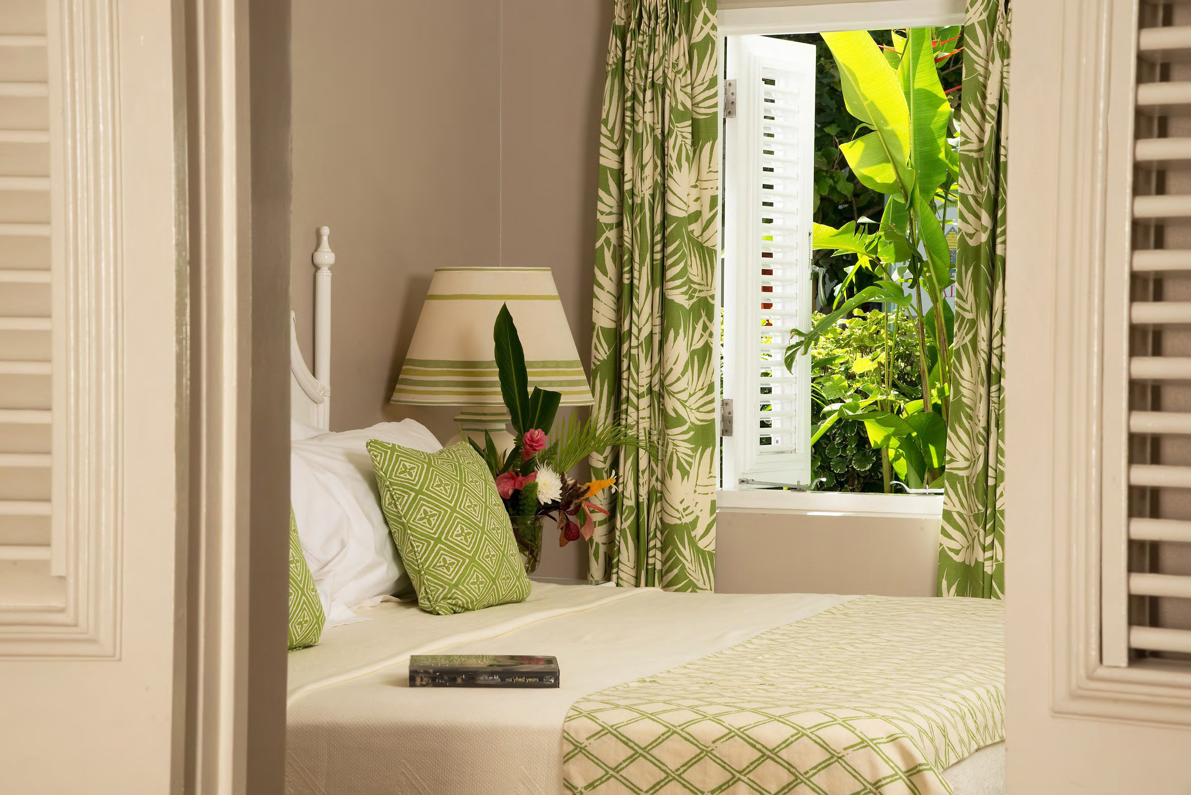 Bed details in a GArden Suite at Cobblers Cove