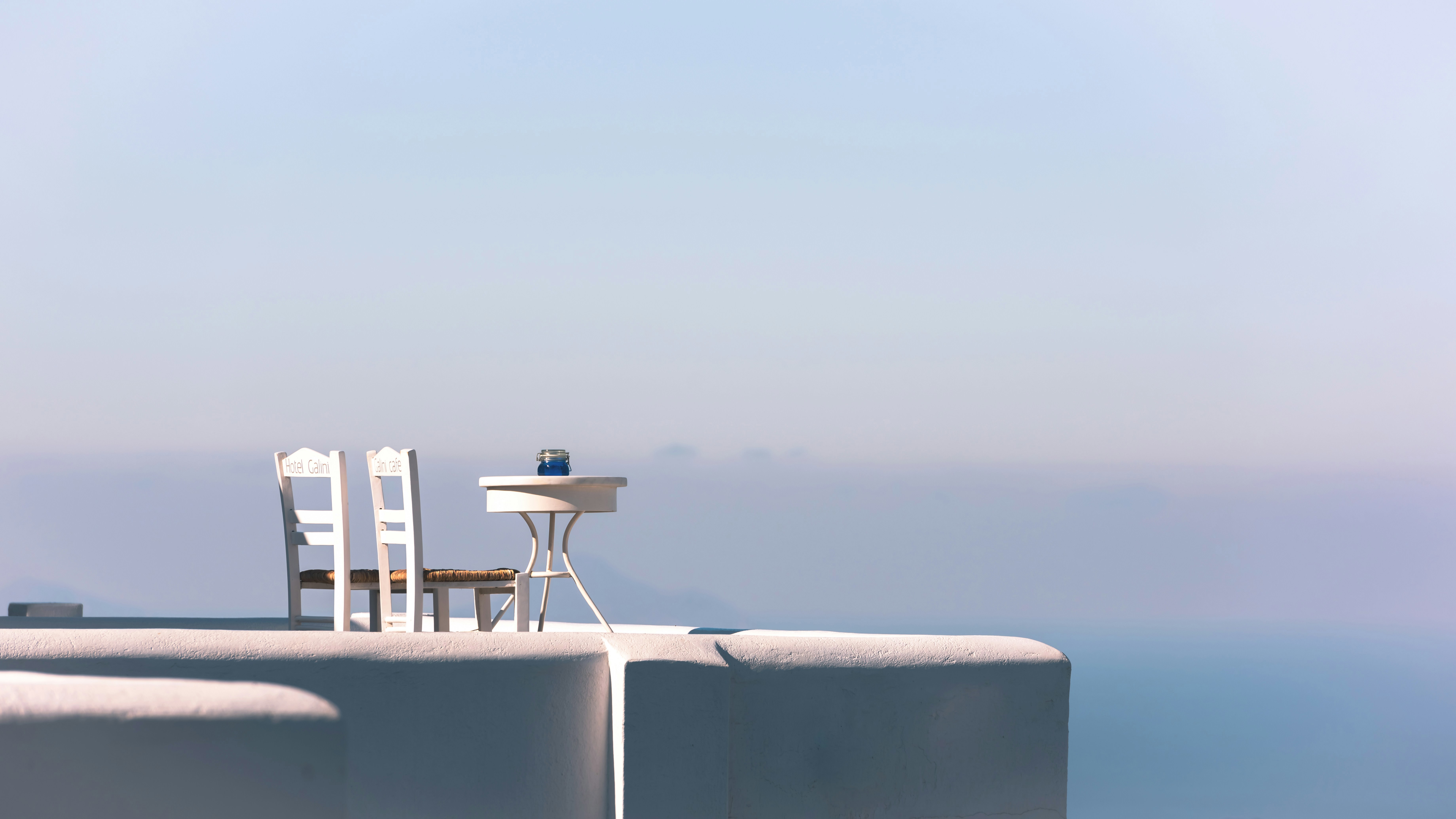 Two seater table and chairs on terrace in Santorini