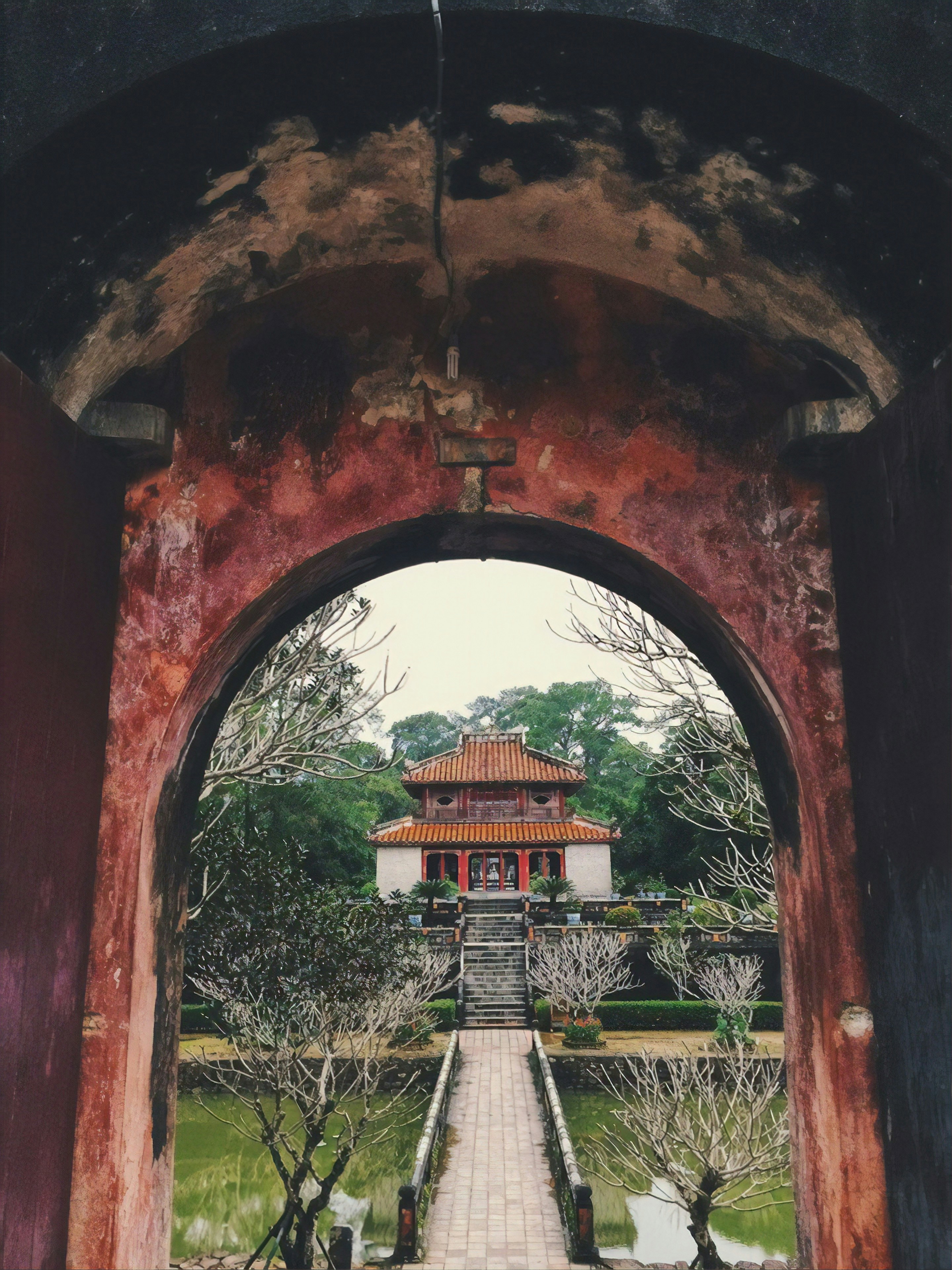 Temple through an archway at The Imperial City in Hue Vietnam