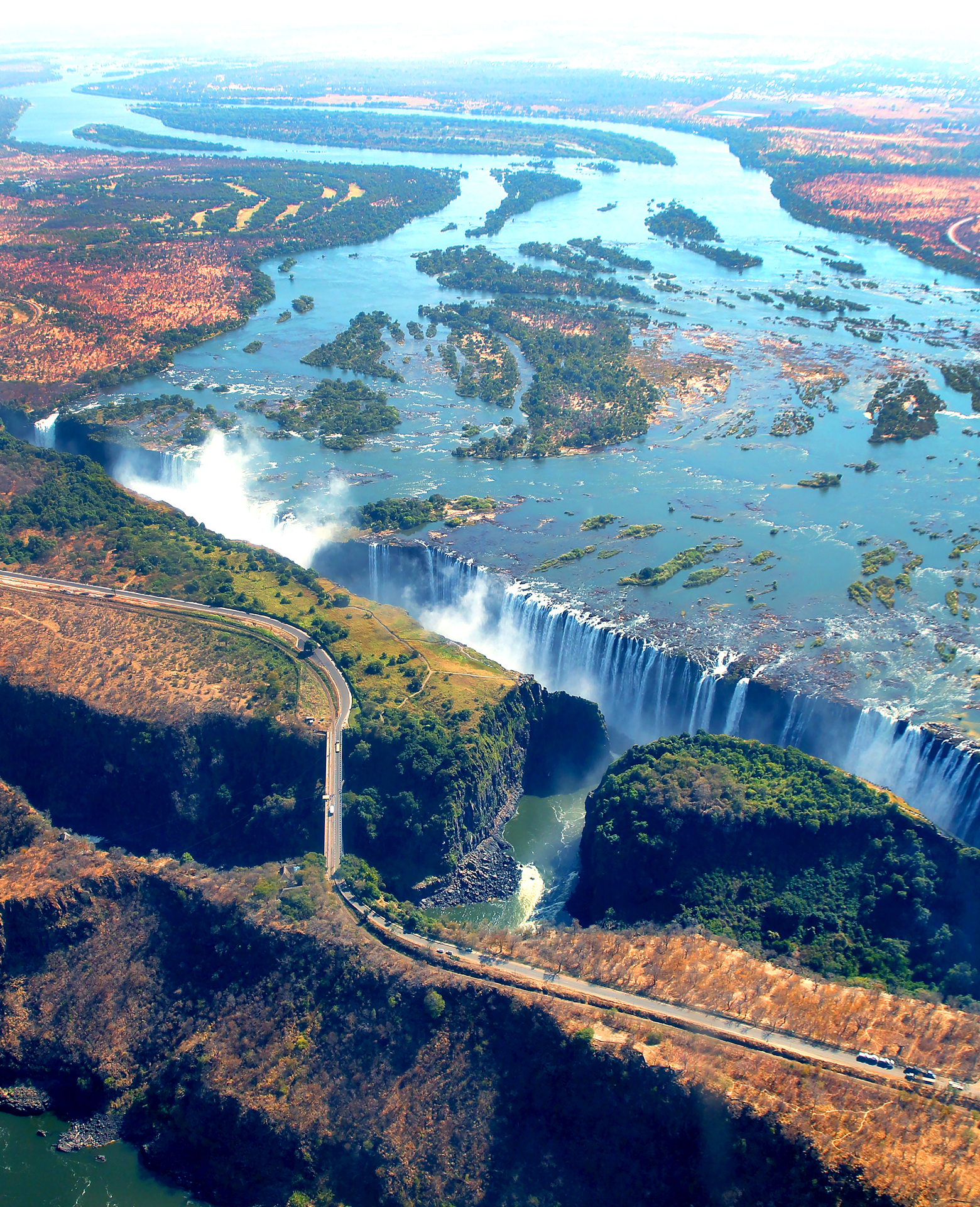 Aerial view of Victoria Falls and nearby bridge
