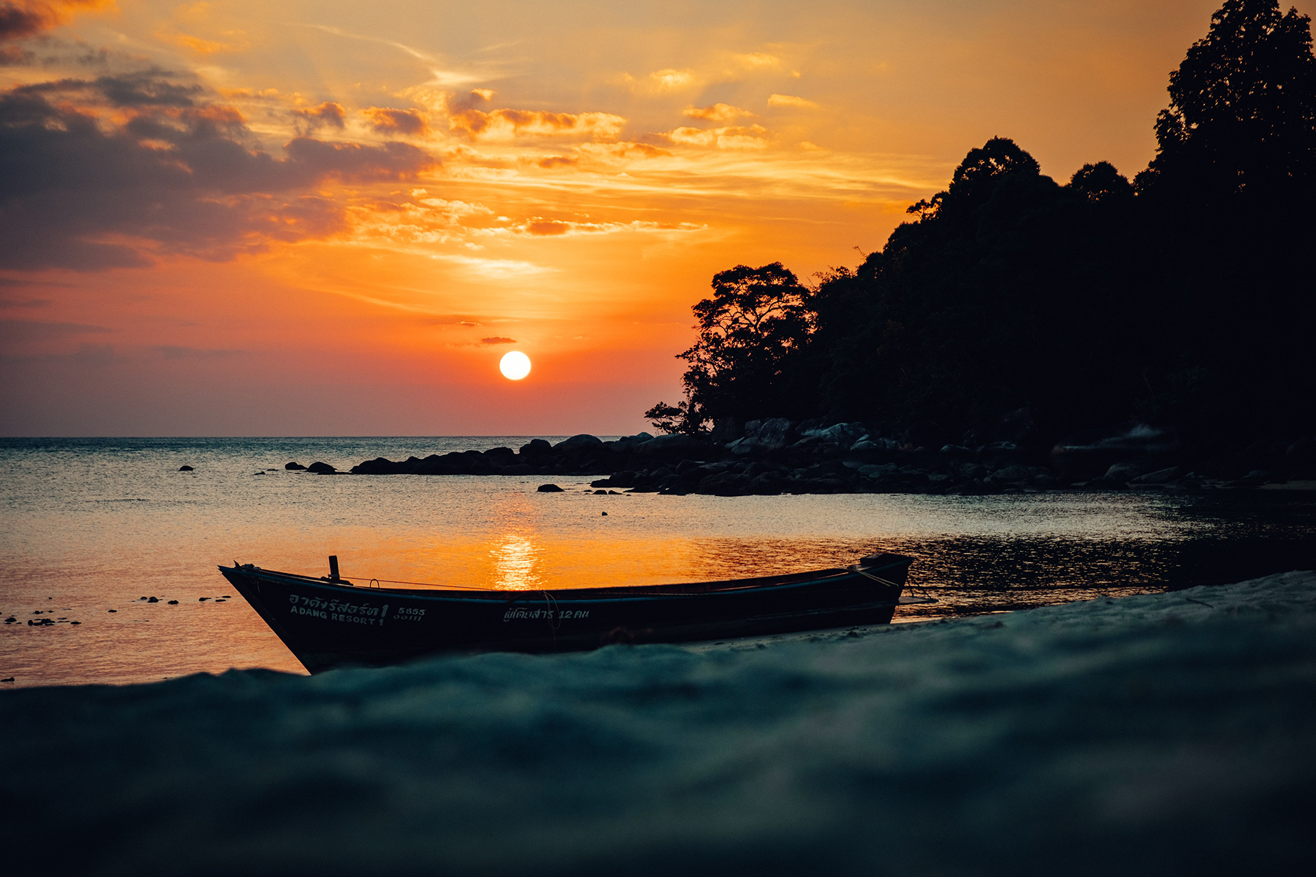 Boat near seashore in sunset