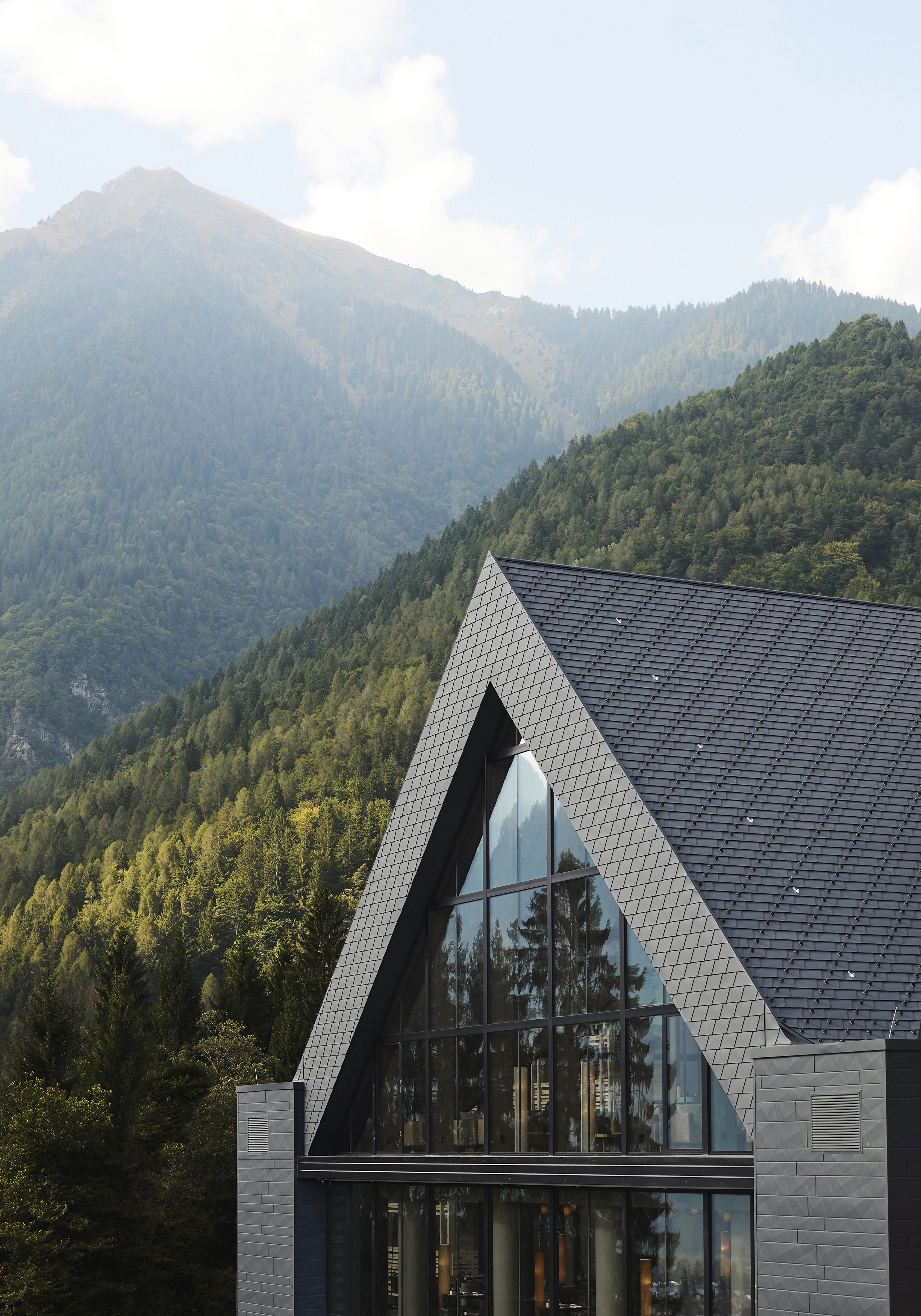 Exterior gable of Lefay Dolomiti with mountains 