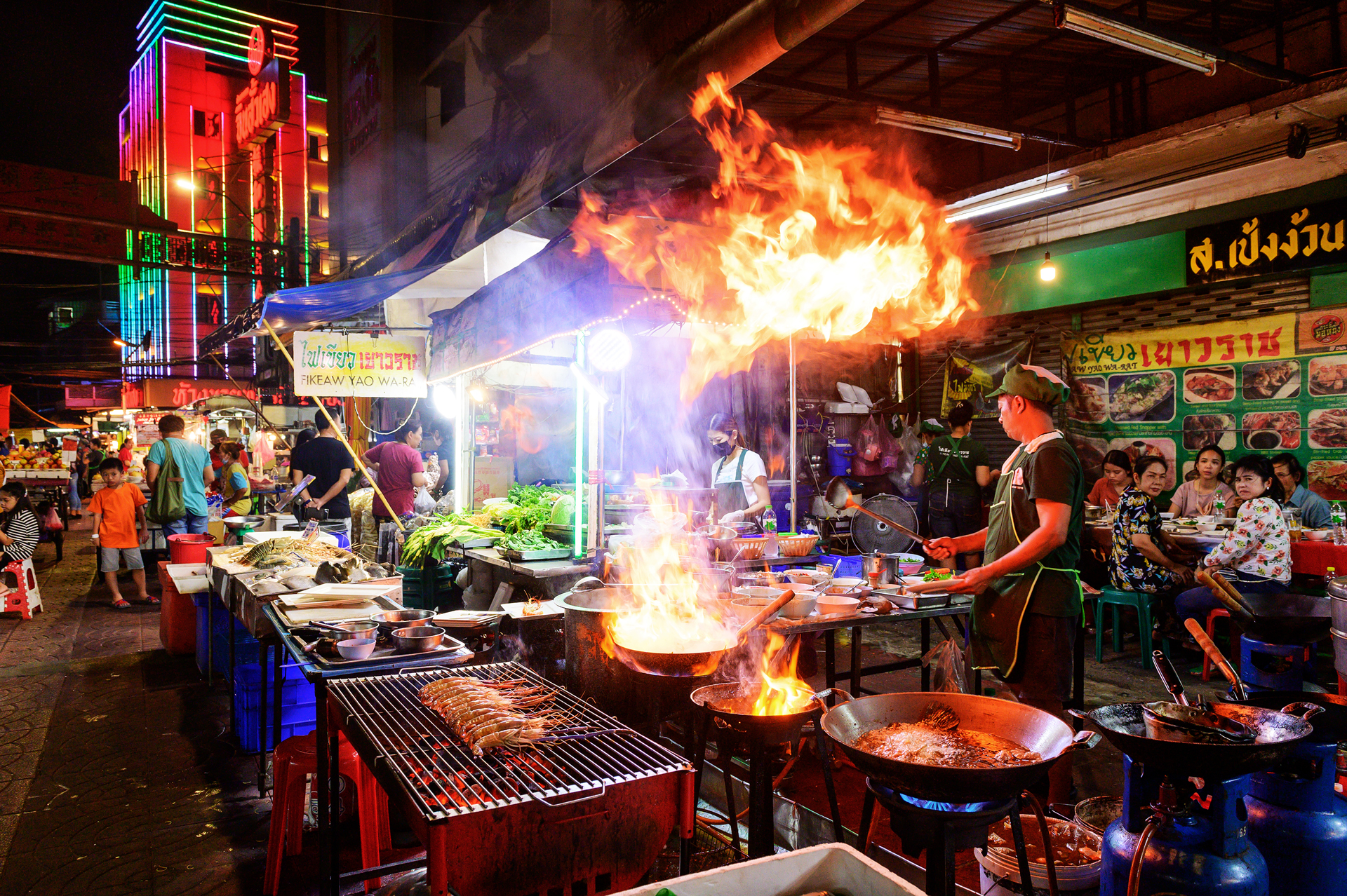 Street side restaurant at night in Yaowarat Road Bangkok