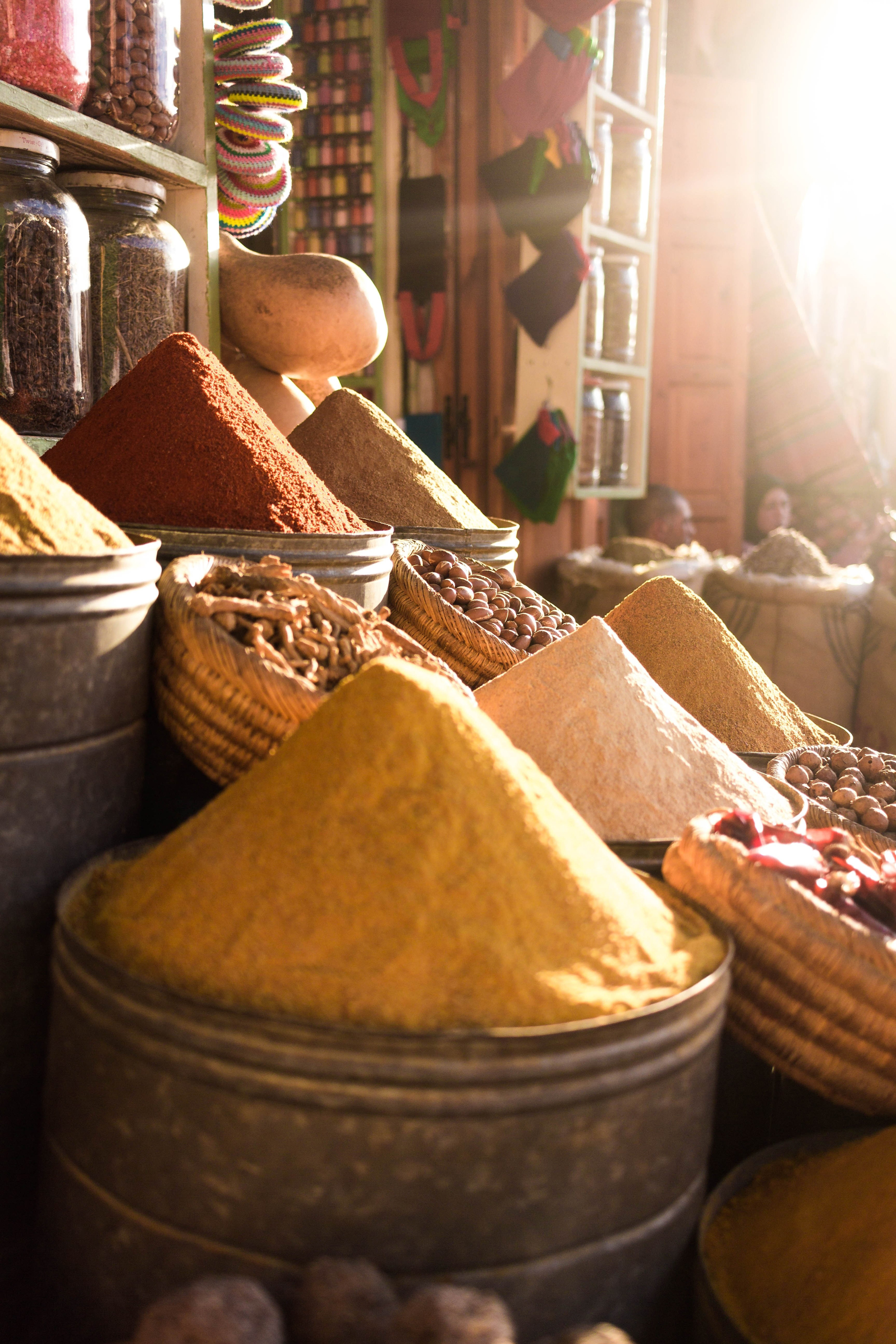 A collection of different spices at a shop front