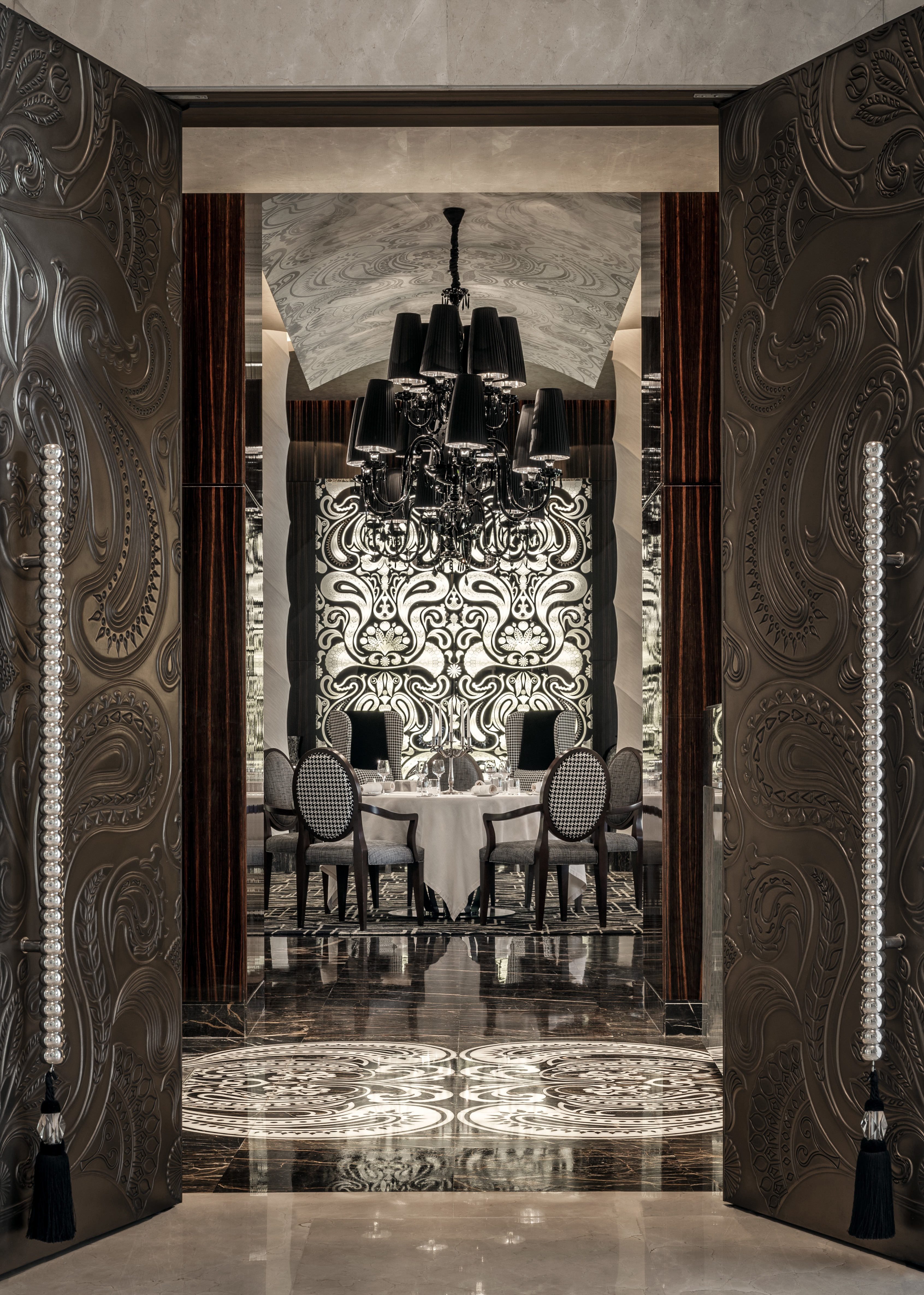 Ornate enterance of STAY restaurant at One& Only The Palm with table set for dinner