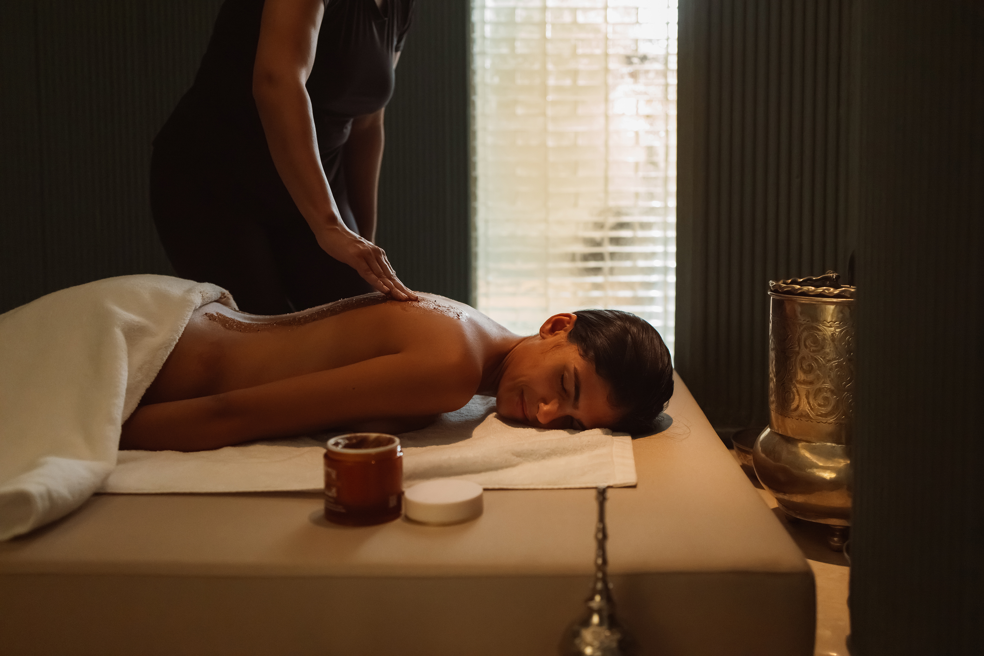 A guest receiving a Hammam massage in a treatment in at Royal Mansour Tamuda Bay