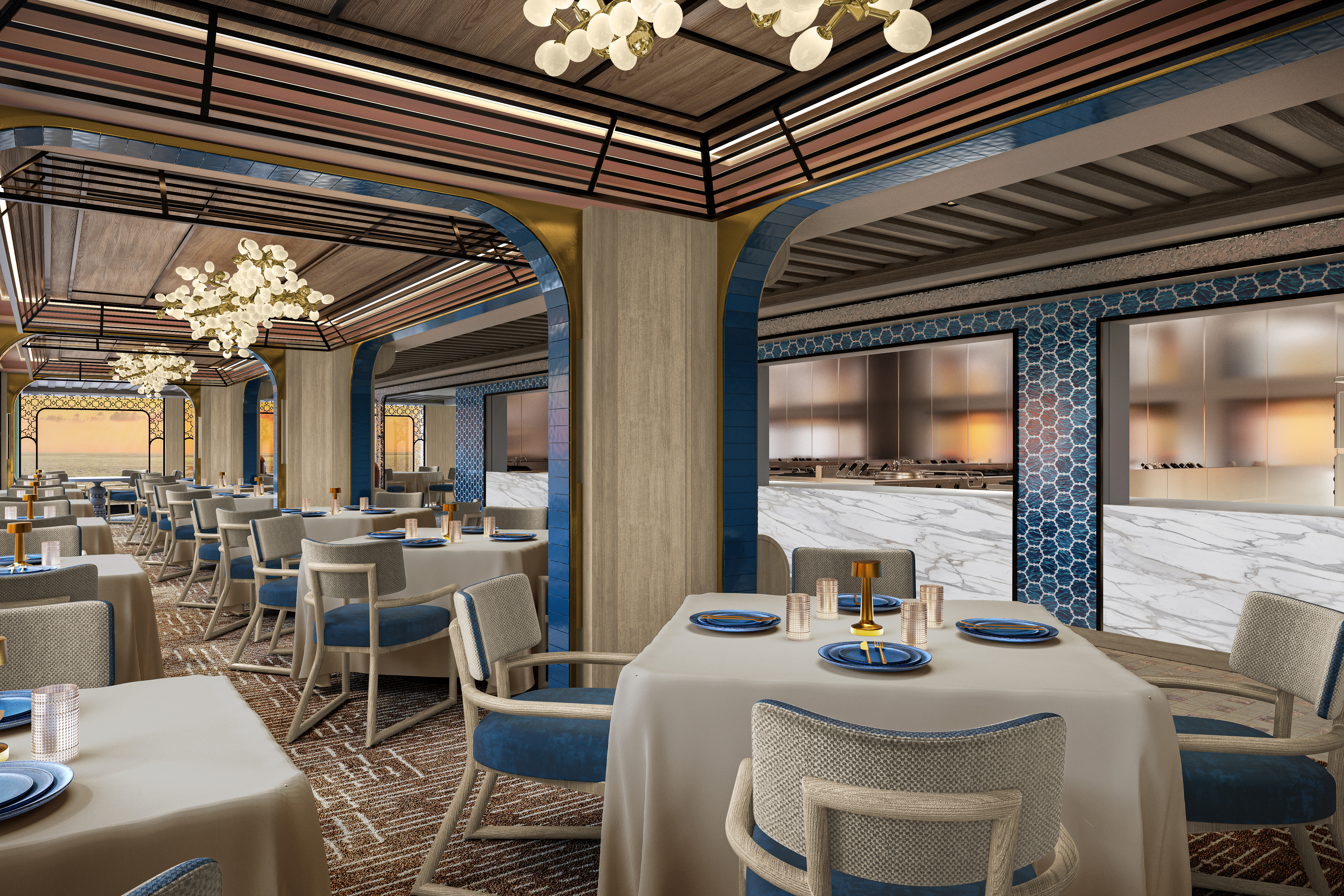 The ornate Mediterranean restaurant aboard Seven Seas Prestige decorated in neutral tones with blue accents and tables set for dinner