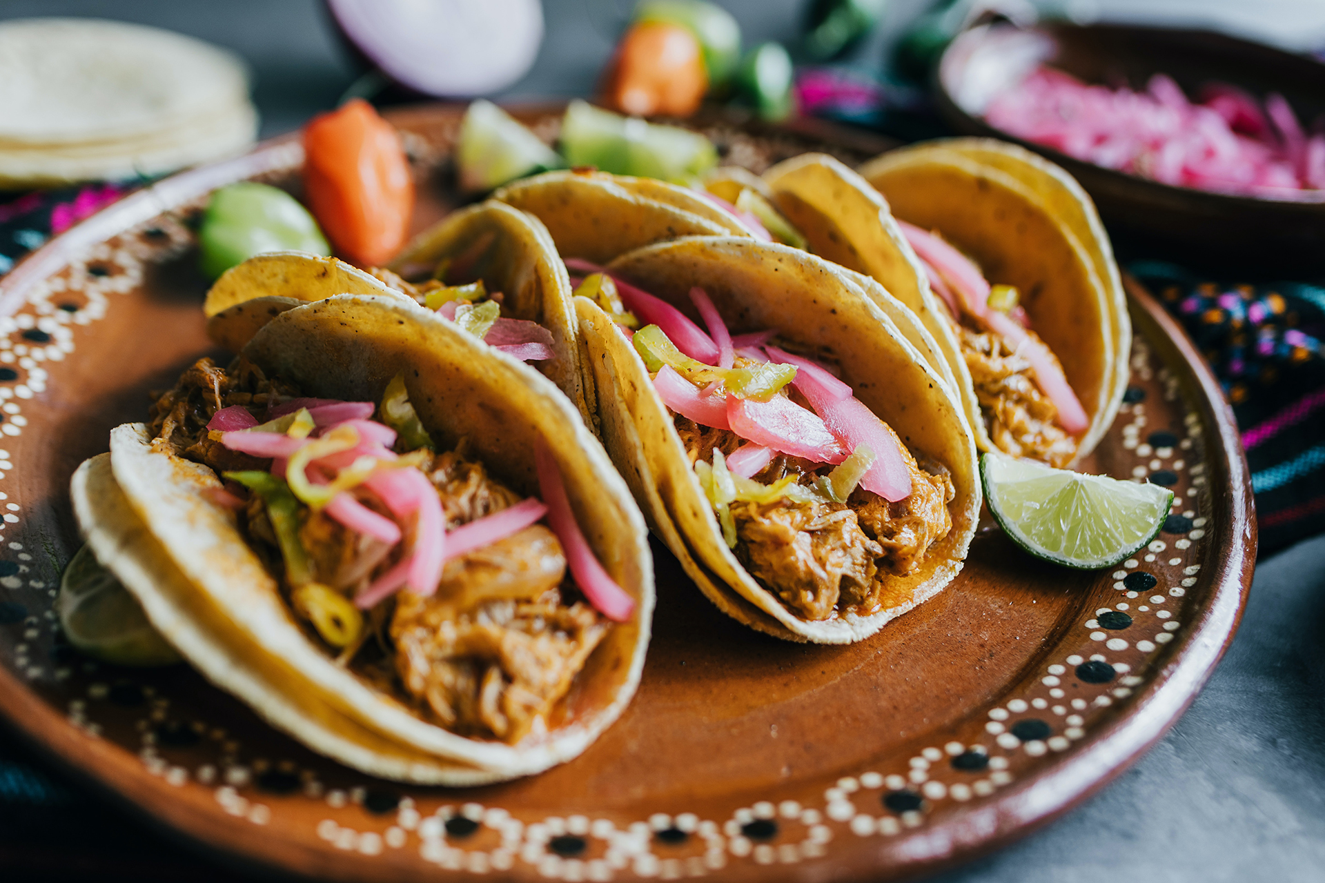 Cochinita pibil tacos on a patterned plate