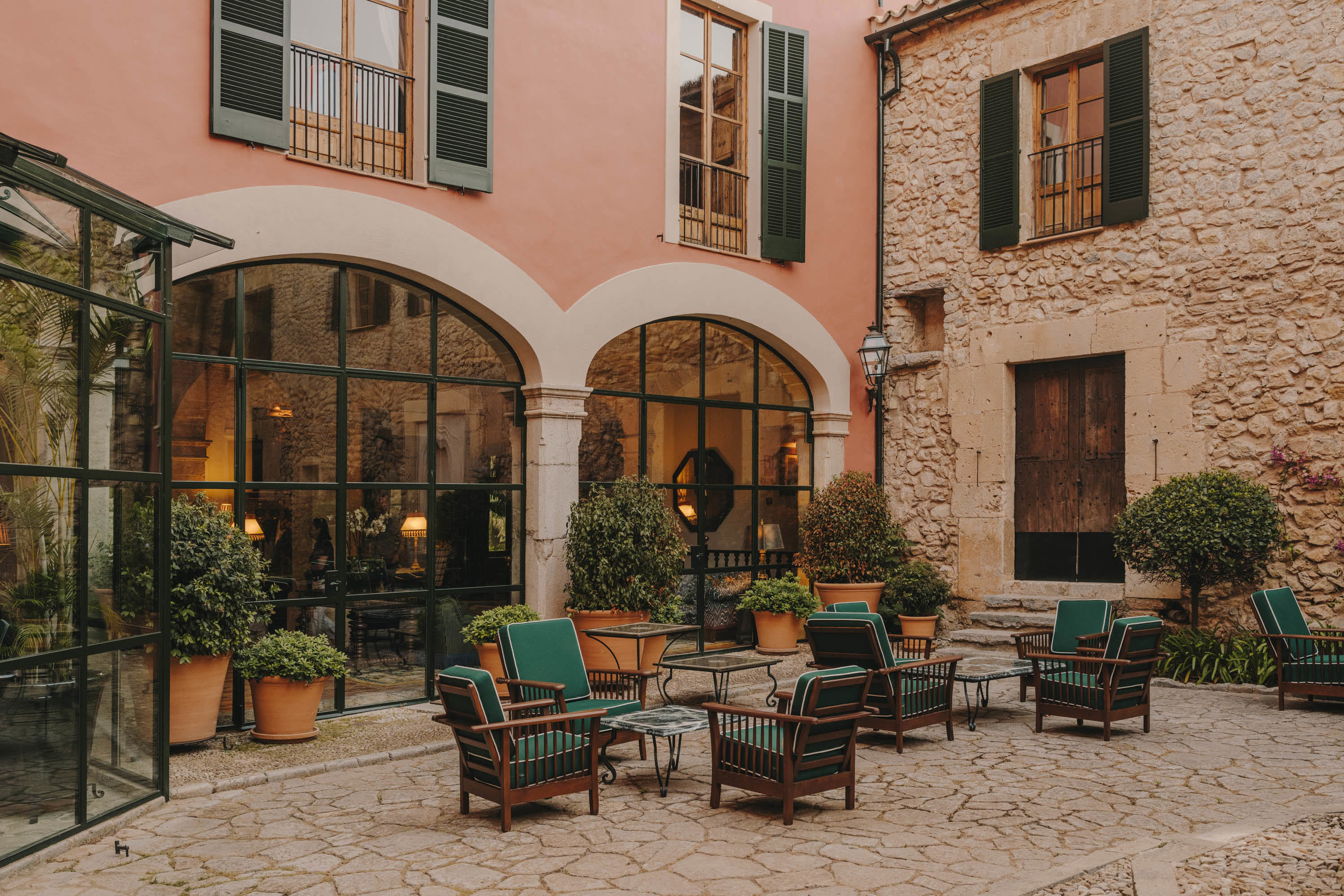 17th century courtyard with green loungers at Son Net