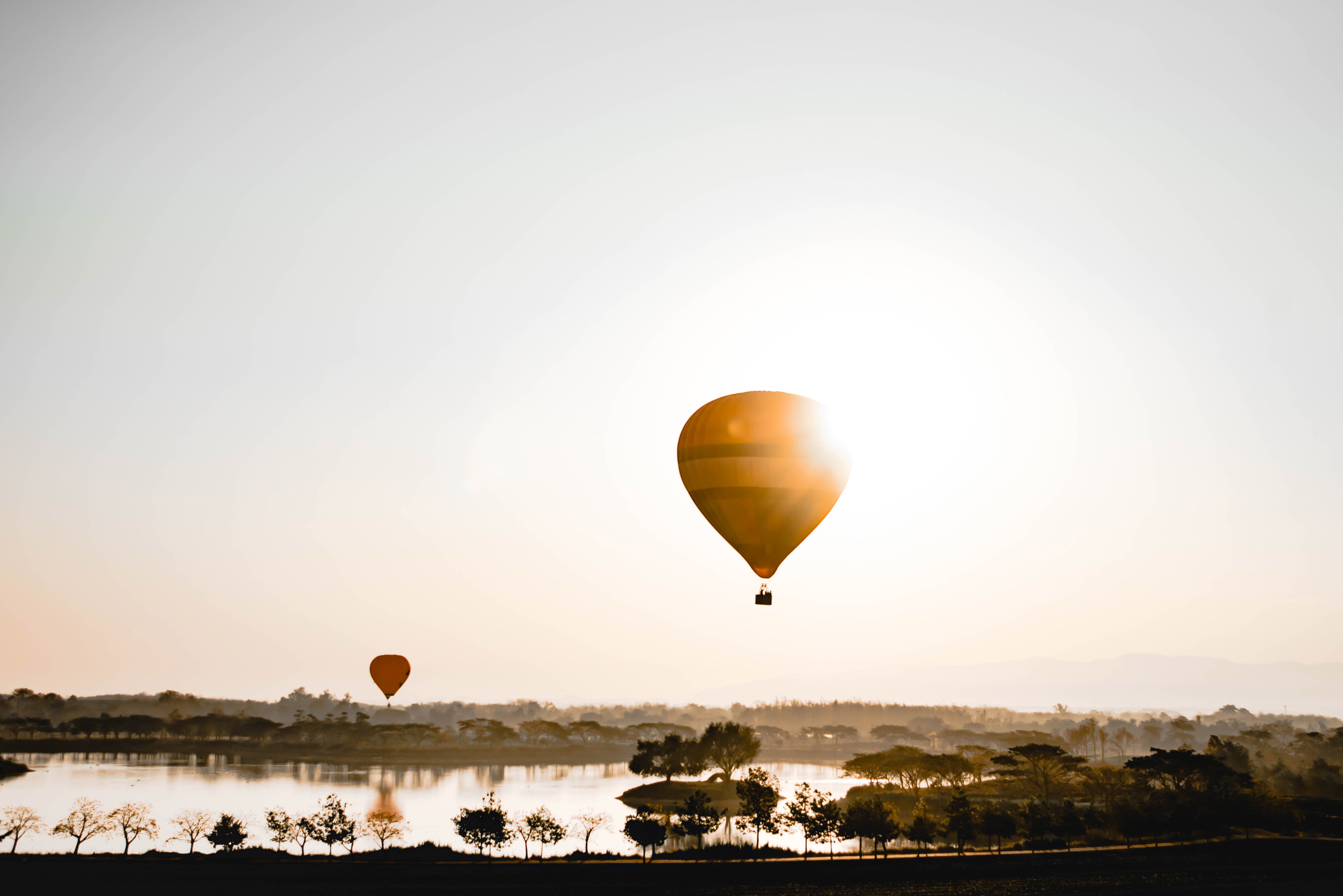 Hot air balloon over a lake in Chiang Rai