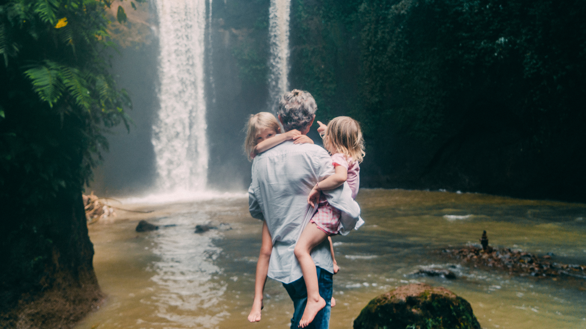 Family By Waterfall