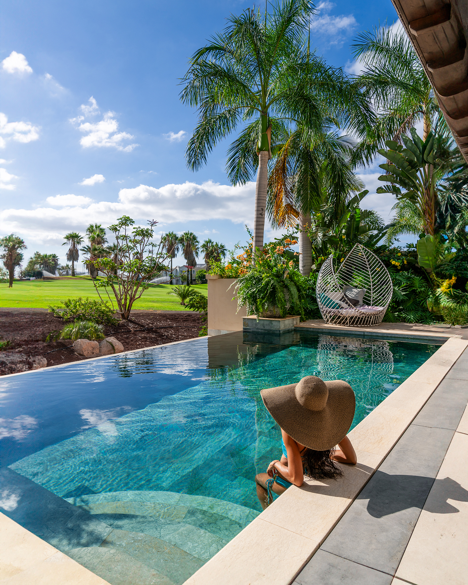 Europe, Spain, Tenerife, Royal River, Grand Pool Villa, woman relaxing in pool