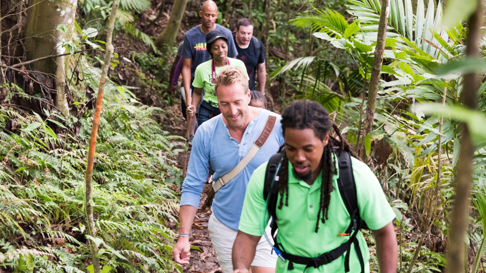 Ben Fogle and guides walking in a Rainforest