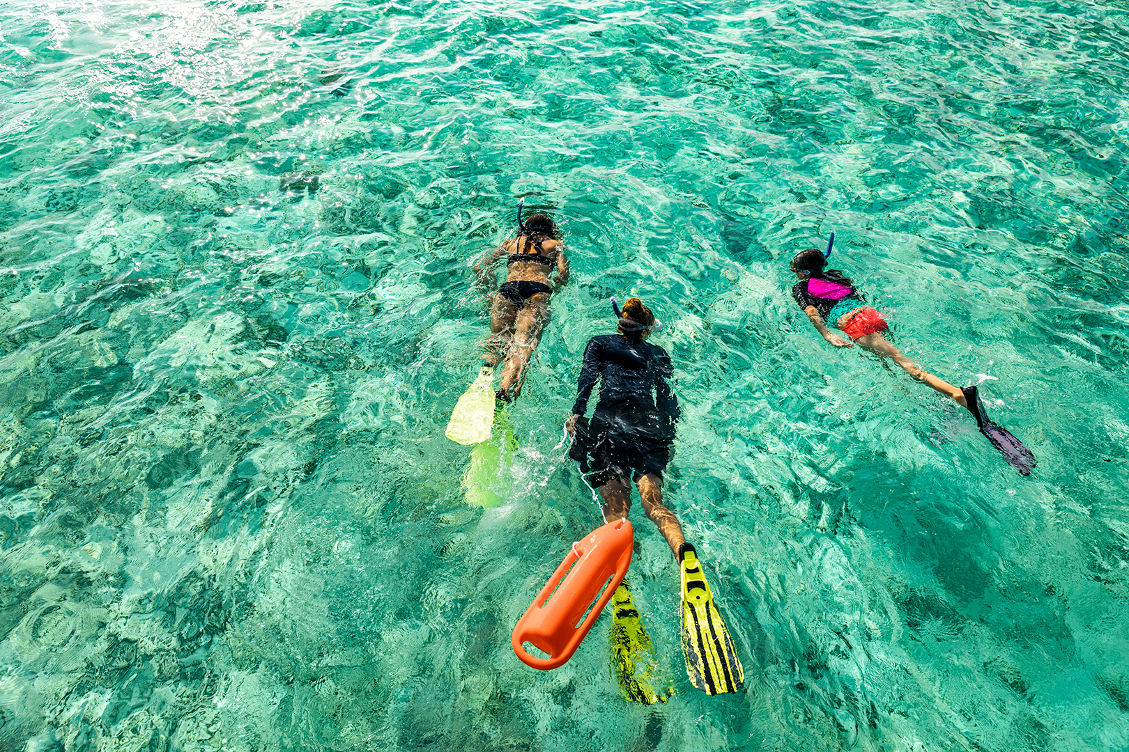 Indian Ocean, Maldives, COMO Maalifushi, People snorkling