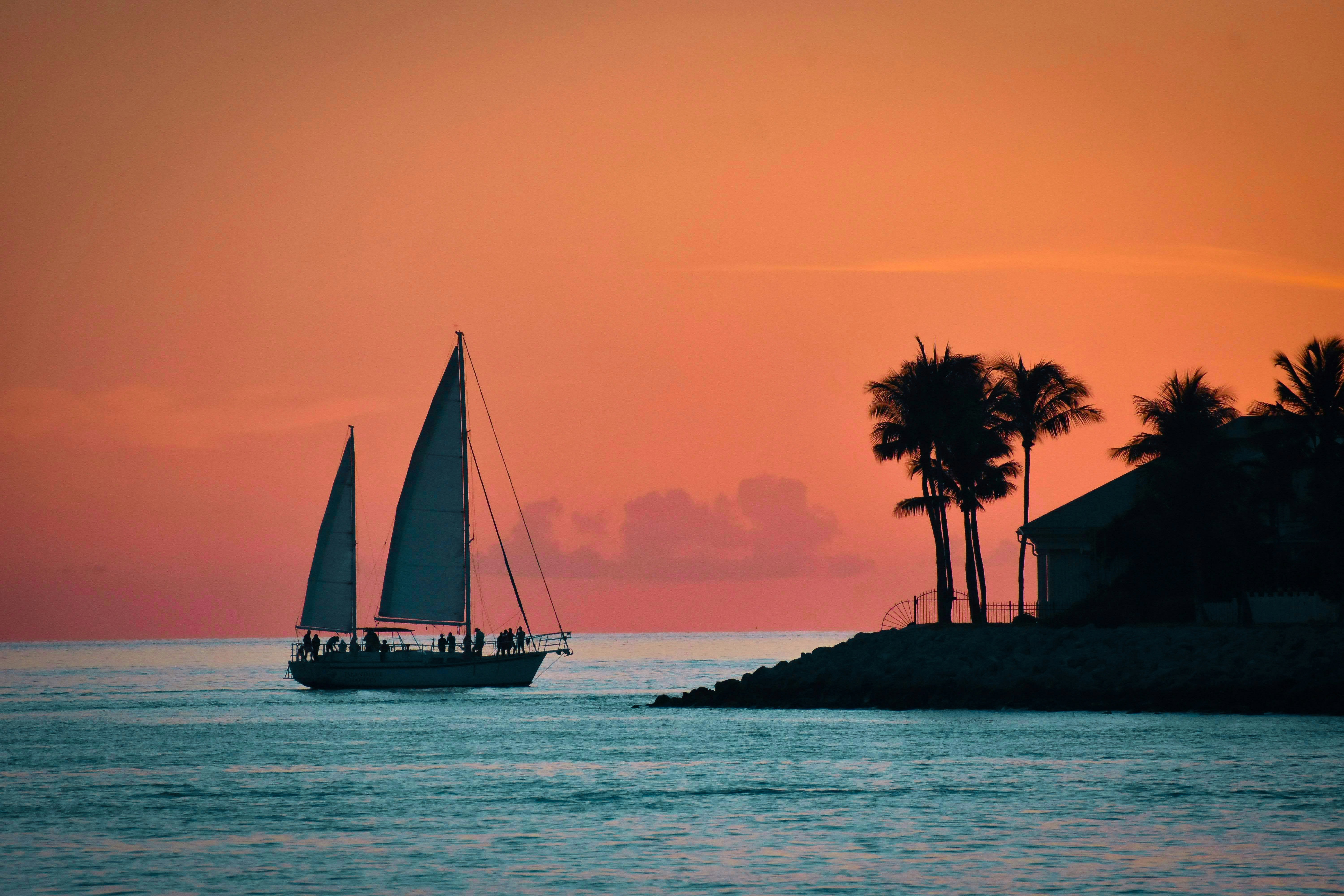 Sailboat crusing out at sunset in Key West