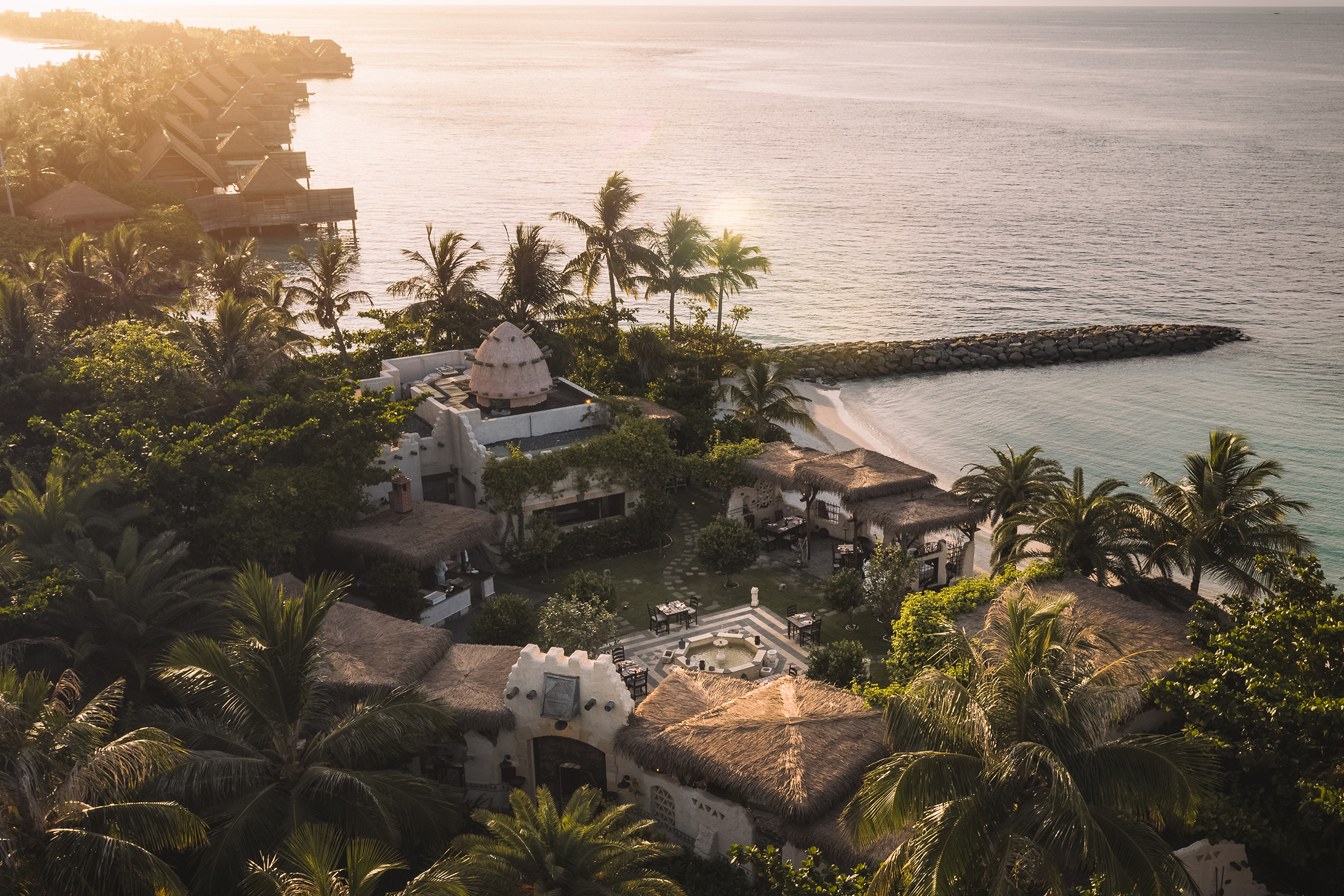 Birds eye view of Yasmeen Restaurant surrounded by palms at sunset