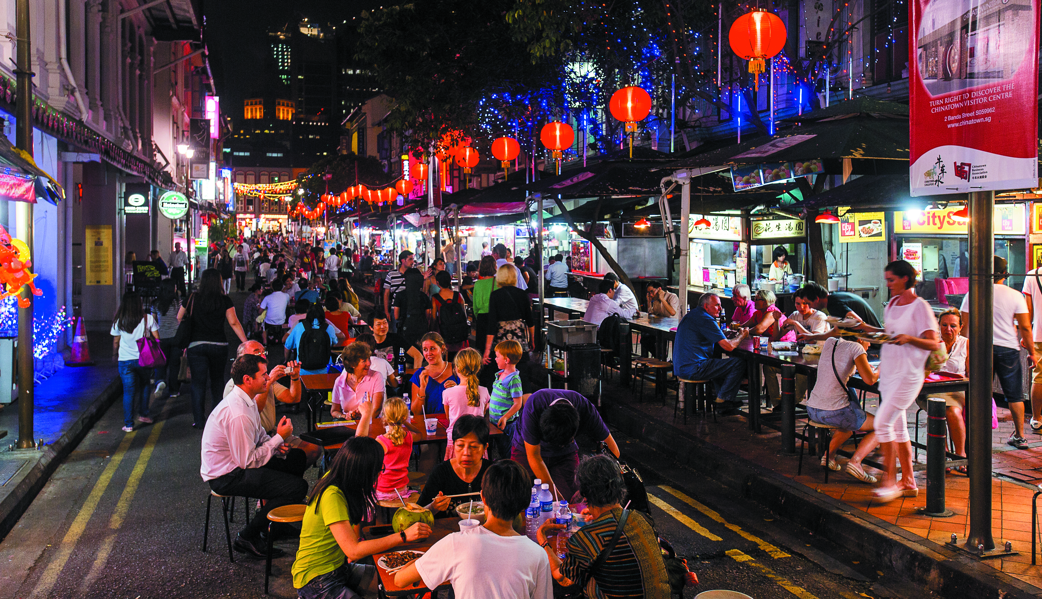 Busy street filled with people eating food in Singapore