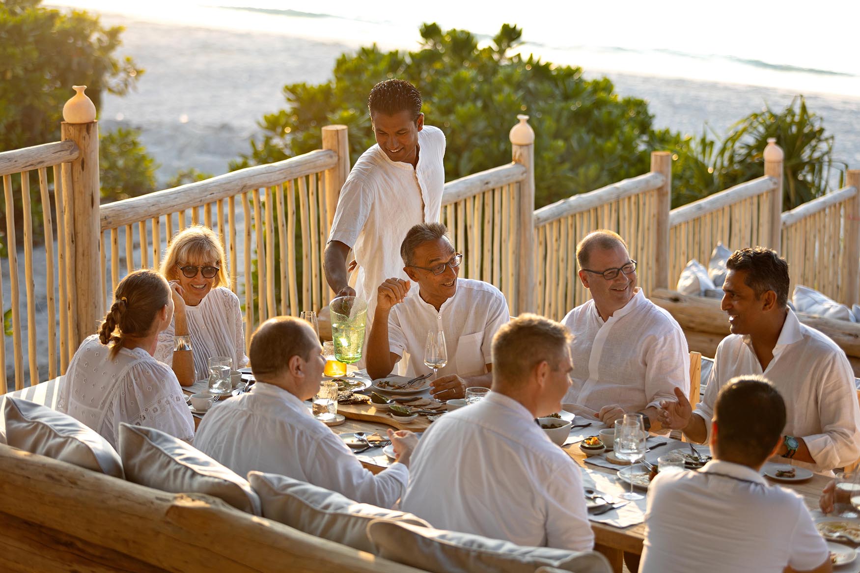 Indian Ocean, Maldives, Soneva Secret, group of people dining together