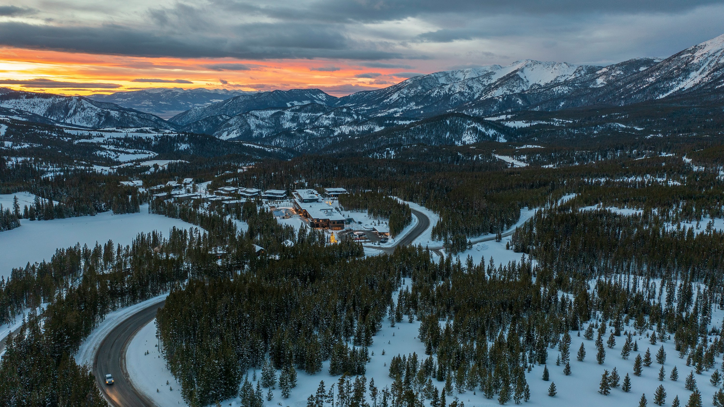 A vast snowy landscape at sunset in Big Sky Ski Resort, Montana