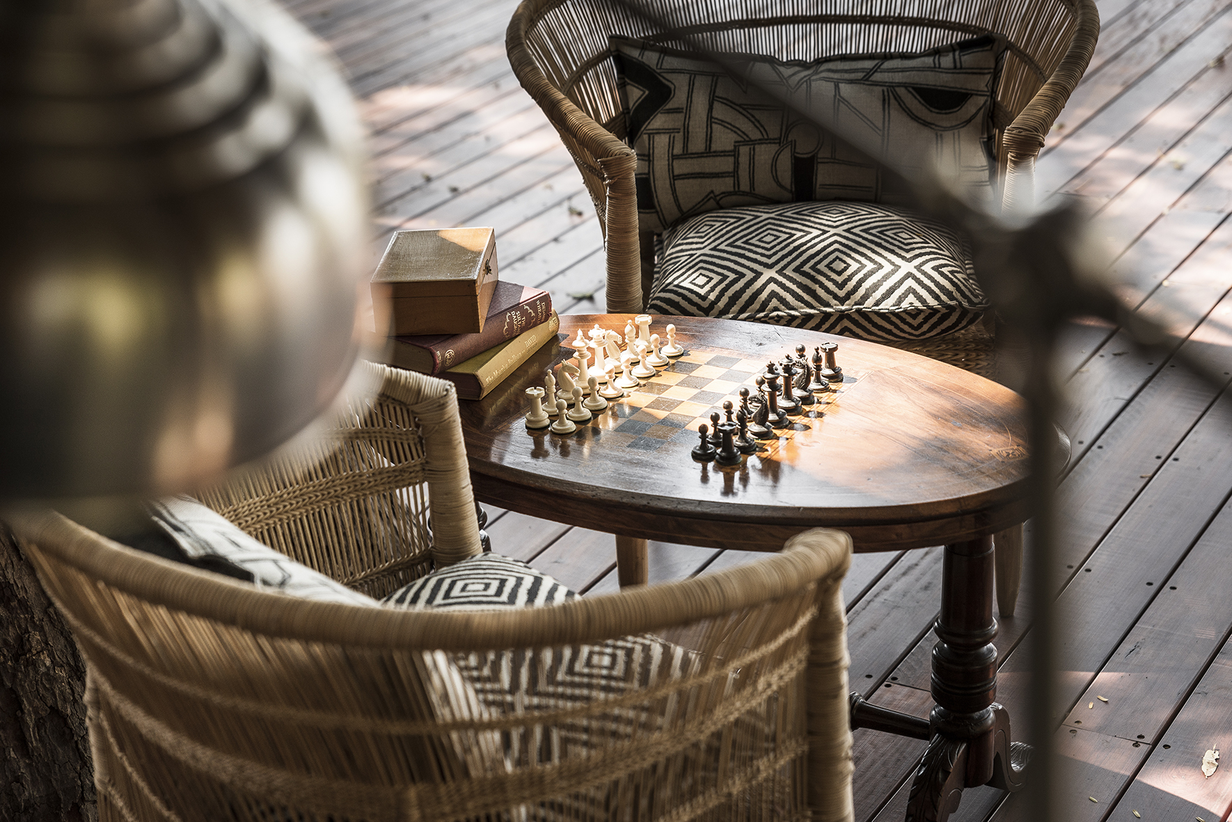 Africa, Zambia, Sungani Lodge, two chairs either side of a table with a chessboard on it