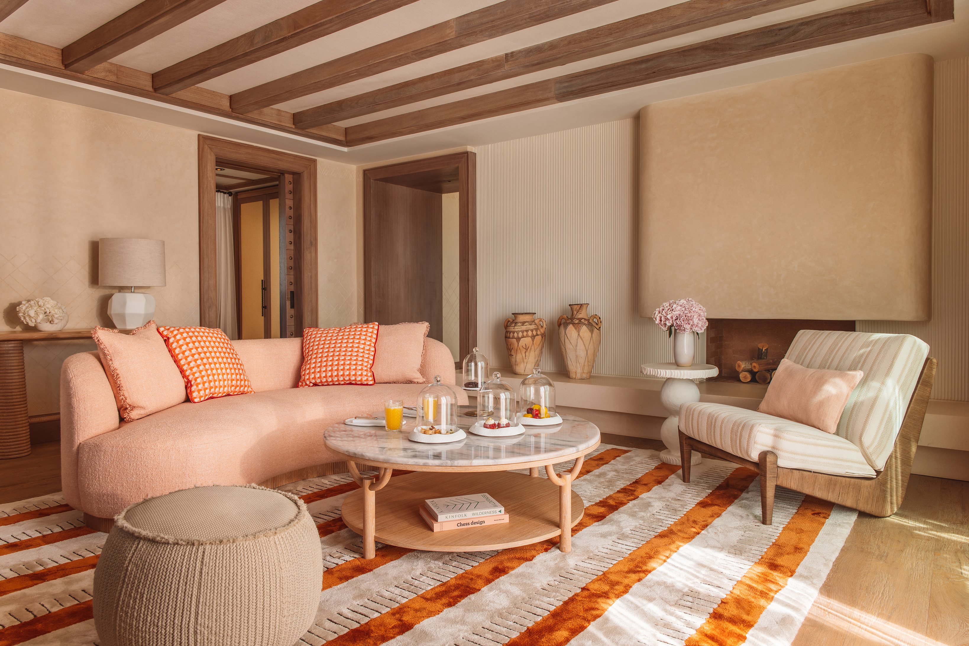 A suite lounge at Royal Mansour Tamuda Bay decorated in neutral tones with Moroccan touches