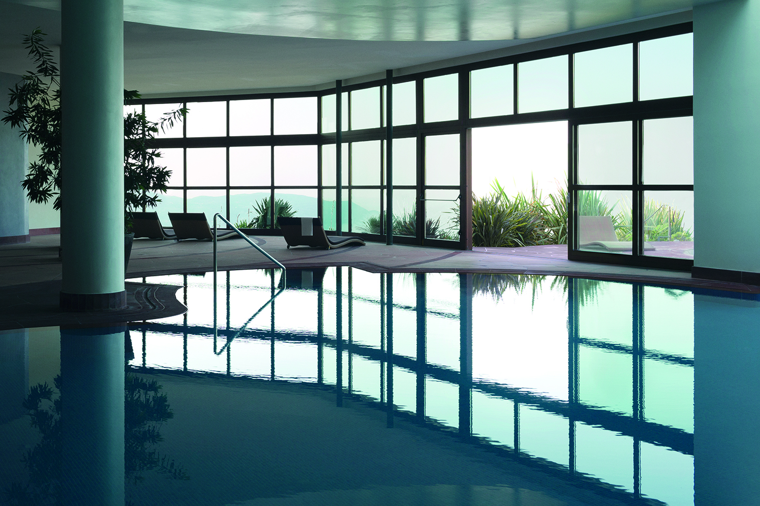 Europe, Italy, Lefay Resort & SPA Lago di Garda, indoor pool with door to outdoor pool