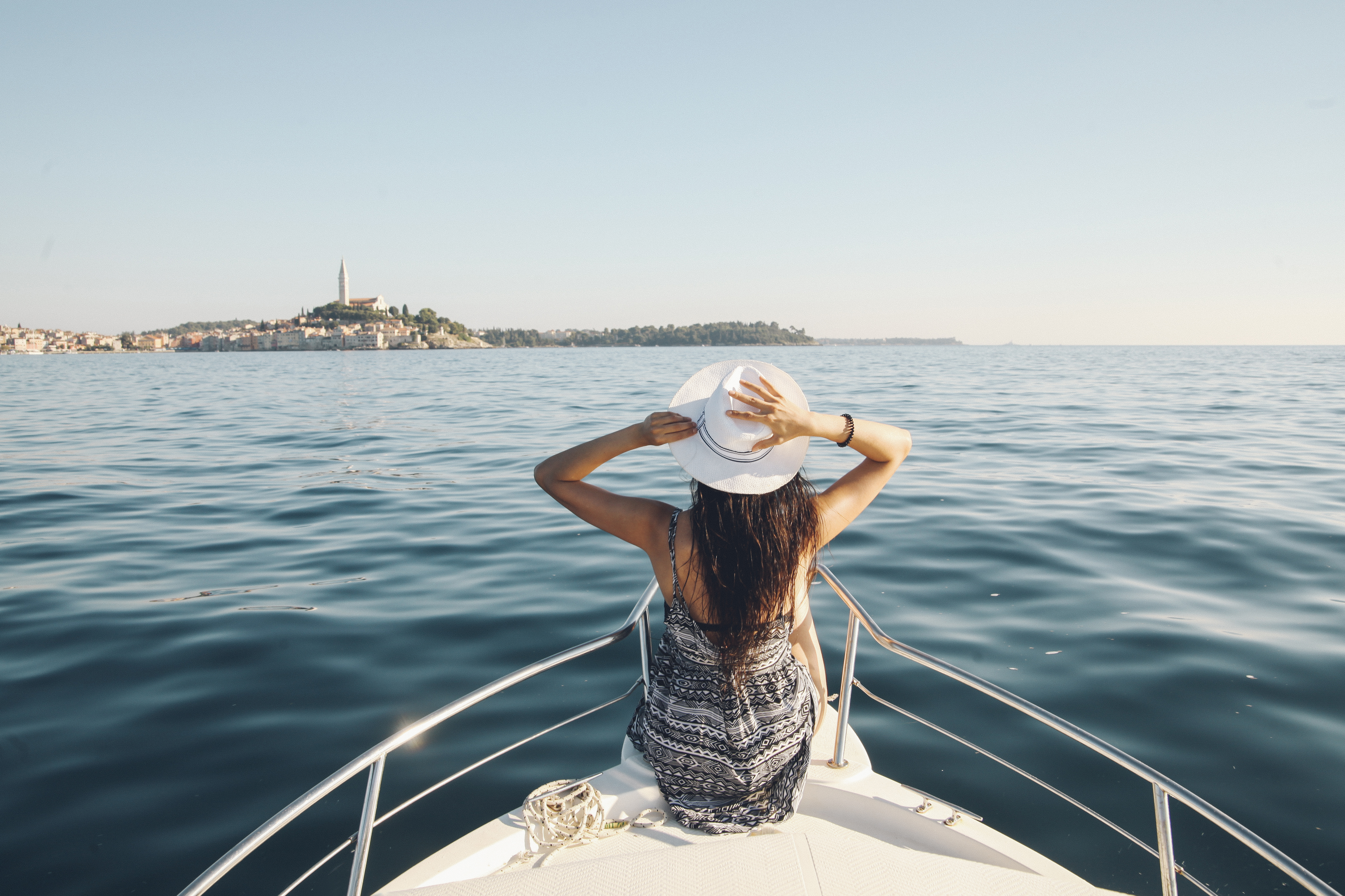 A woman sat on a boat off the coast of Croatia