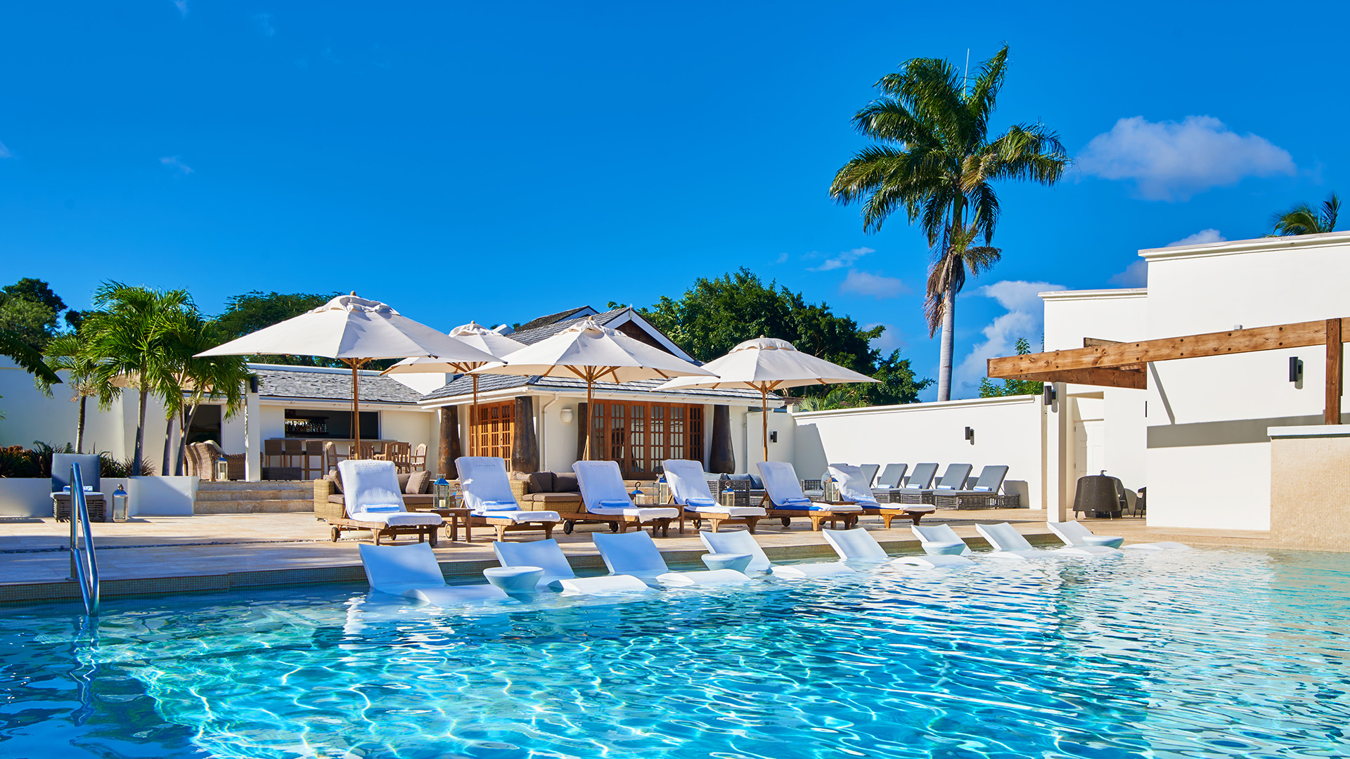 Caribbean & Mexico, Grenada, Calabash Hotel, A view of the main pool and loungers with part of the hotel behind