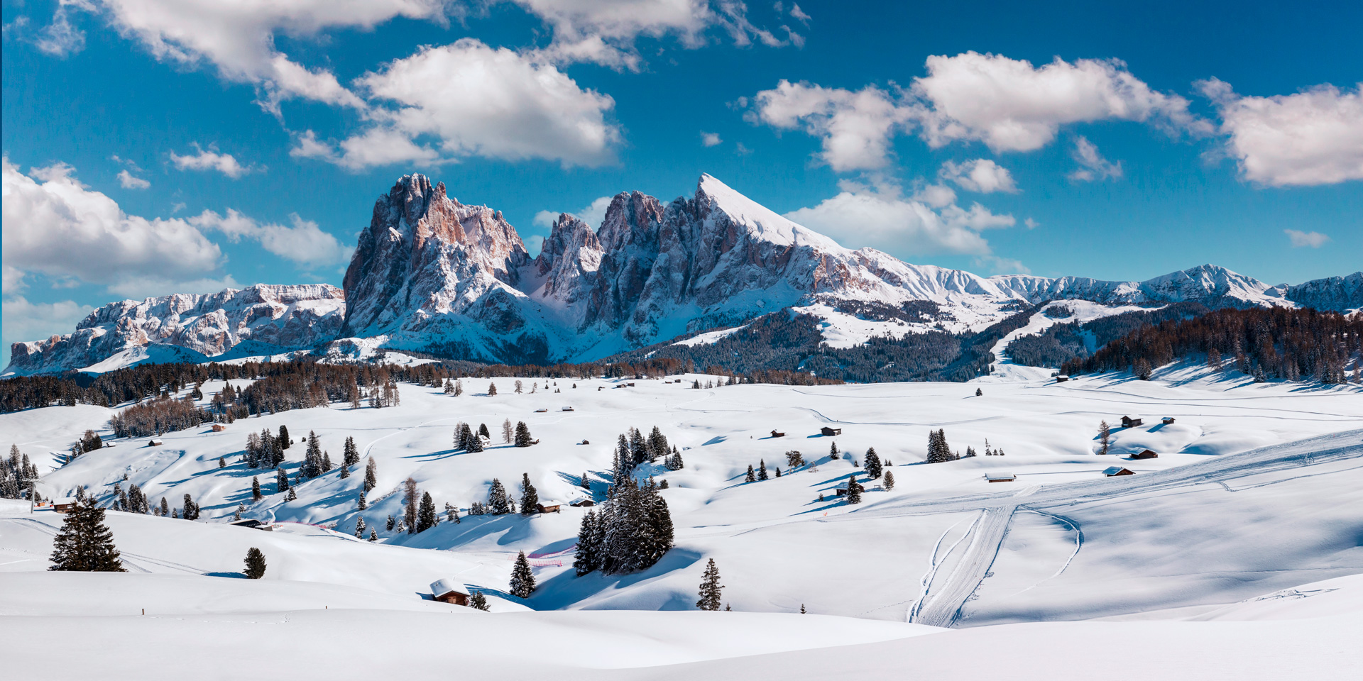 Winter Day at Alpe di Siusi with view on Sassolungo and Sassopiatto, Dolomites, Italy