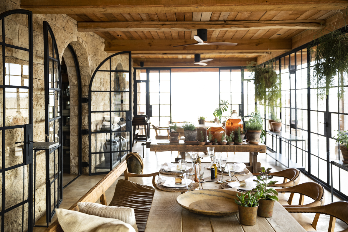 A light and airy lounge area with tables and plants