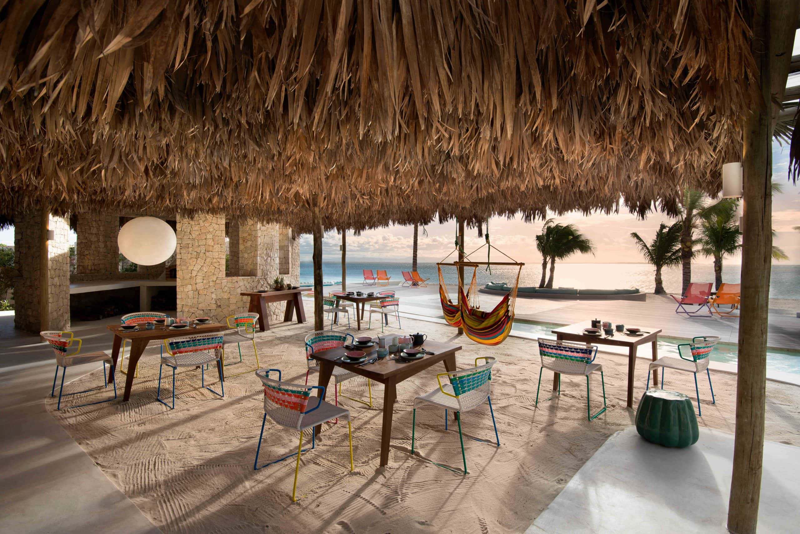 Chair and hammocks of Miavana piazza set up for a meal
