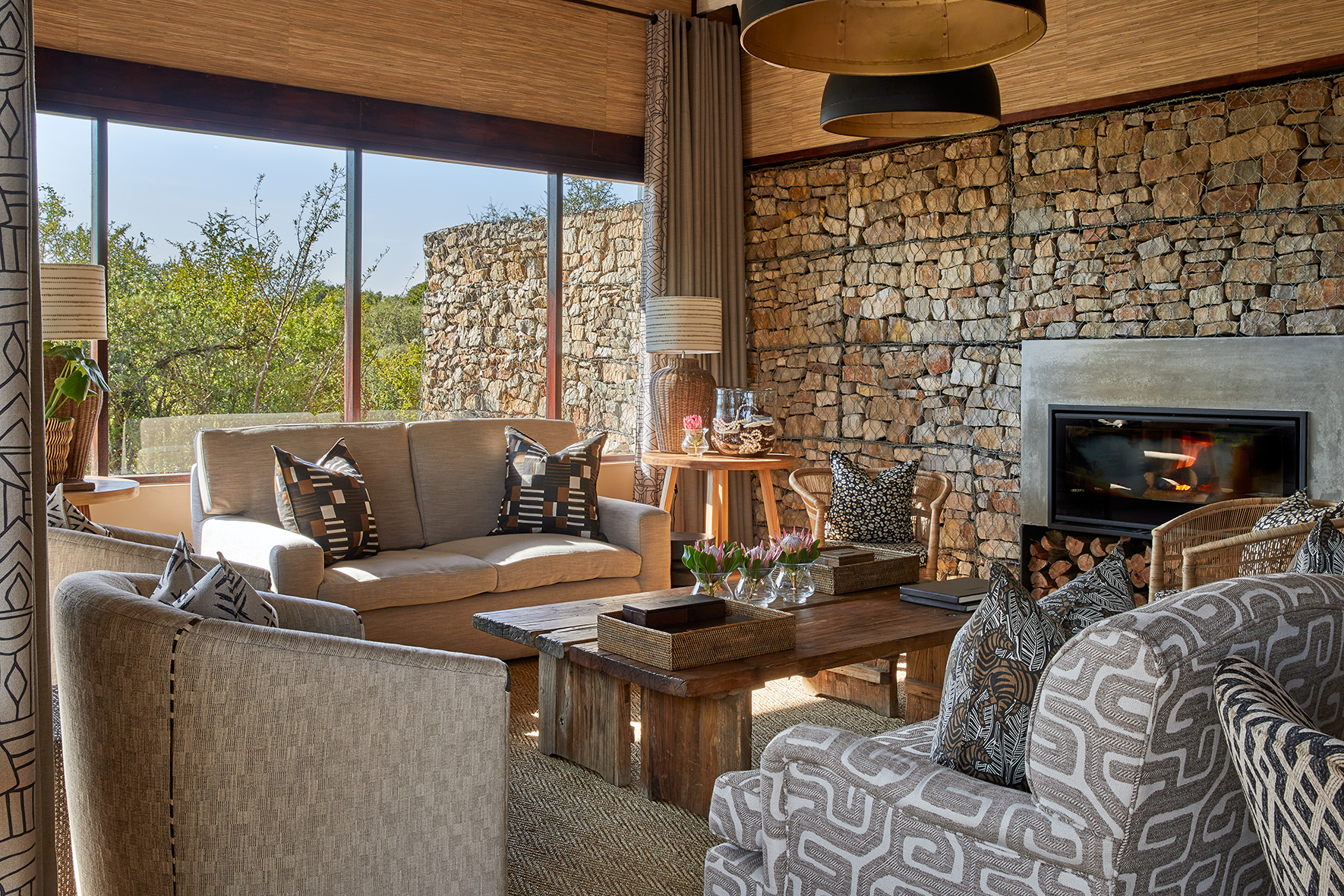 Africa, South Africa, Kwandwe Private Game Reserve, Ecca Lodge, indoor seating by the fire 