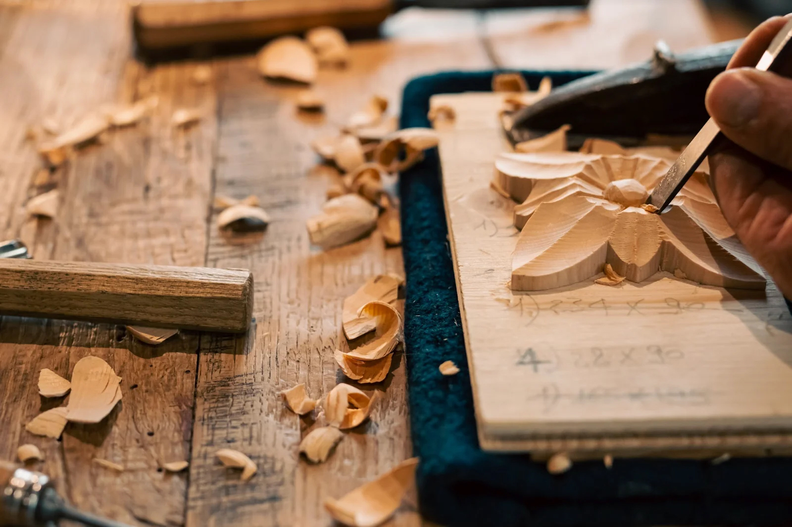 Hand whittling wooden decoration in the shape of a flower