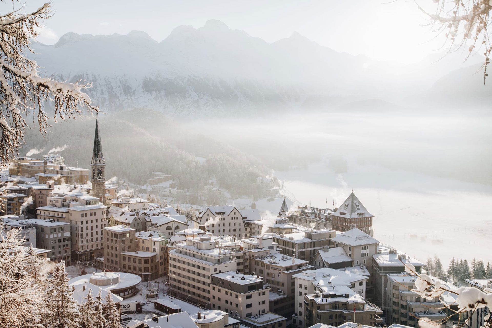 An aerial view of the snow covered roofs in the town of St Moritz