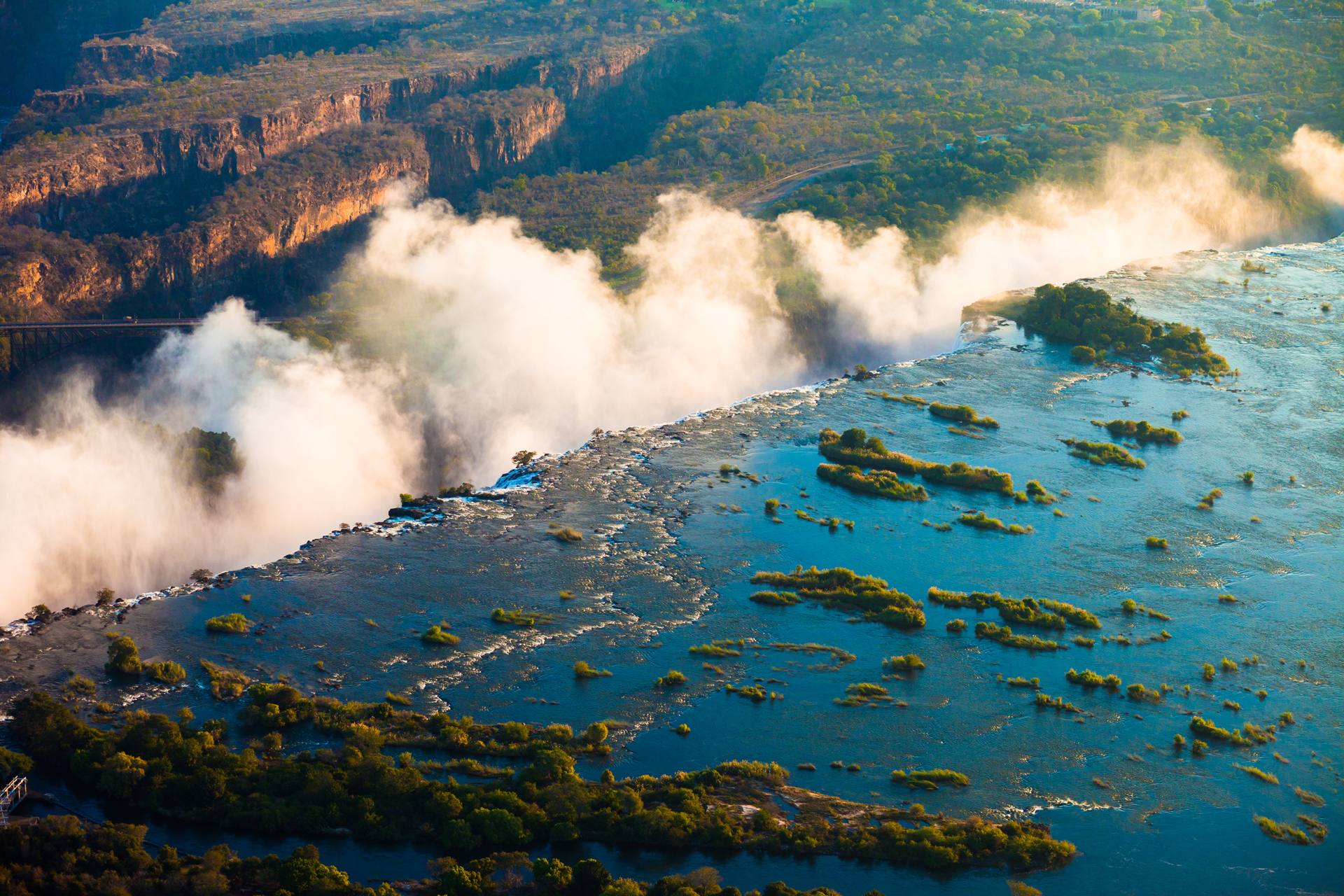 a river with a large body of water that turns into a waterfall