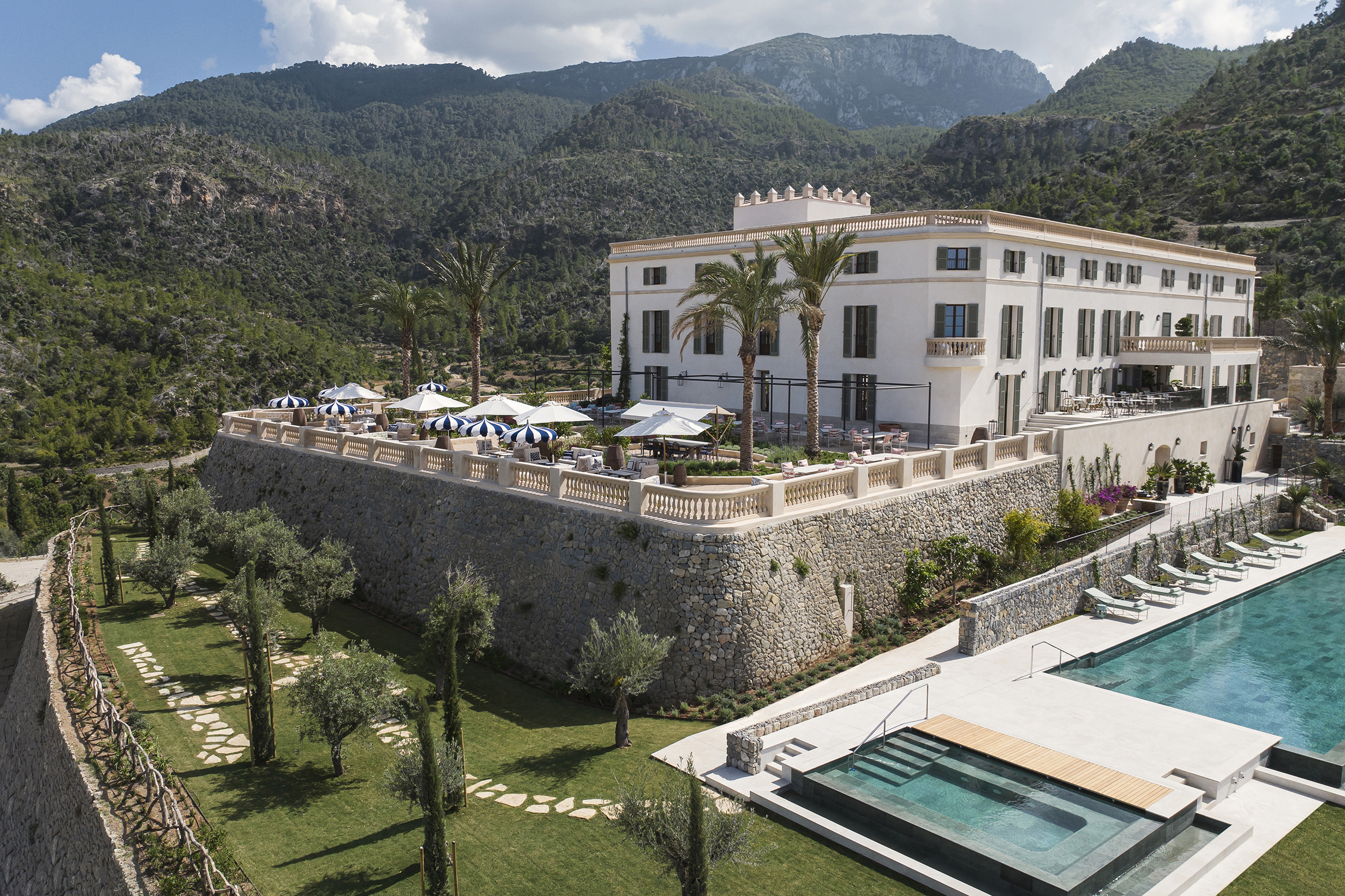 Exterior and main pool of Son Bunyola with paths leading to gardens