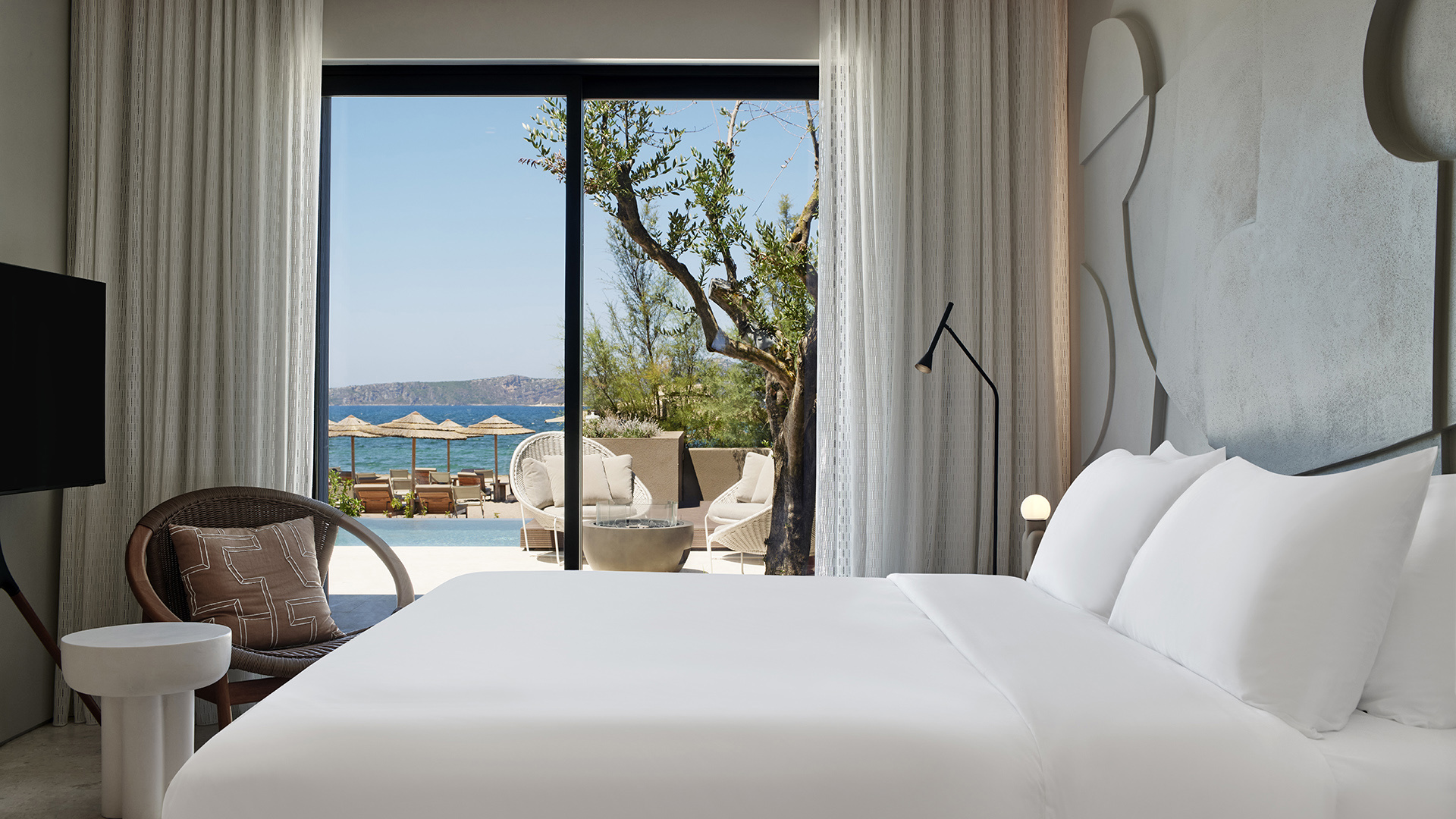 Villa bedrom with beach view and private pool and olive tree outisde at W Costa Navarino