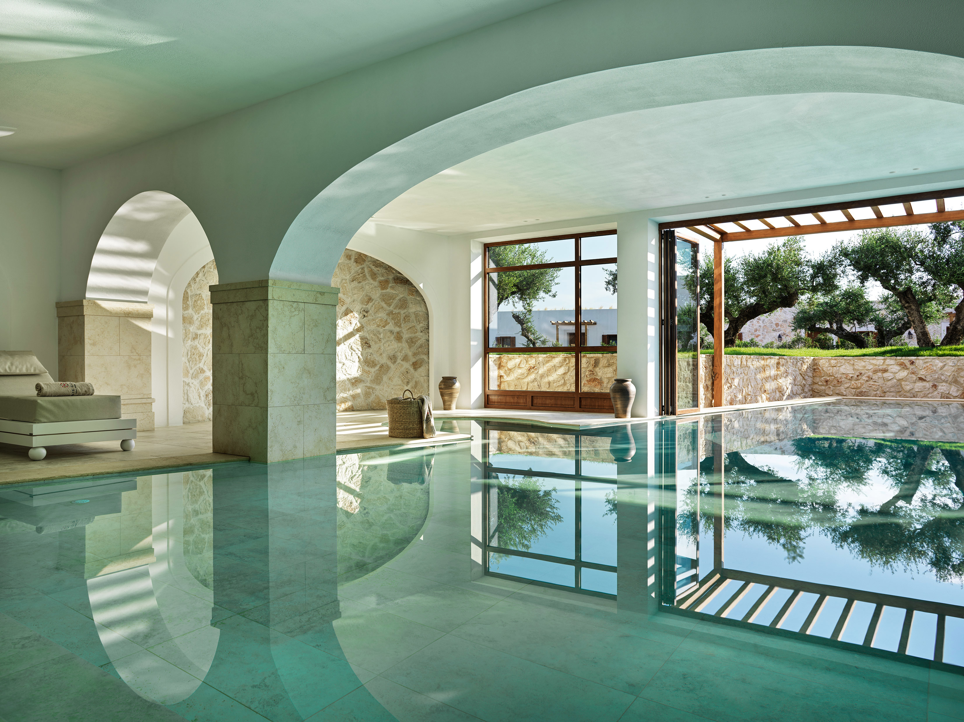 Indoor pool with ceiling archways at Lesante Cape