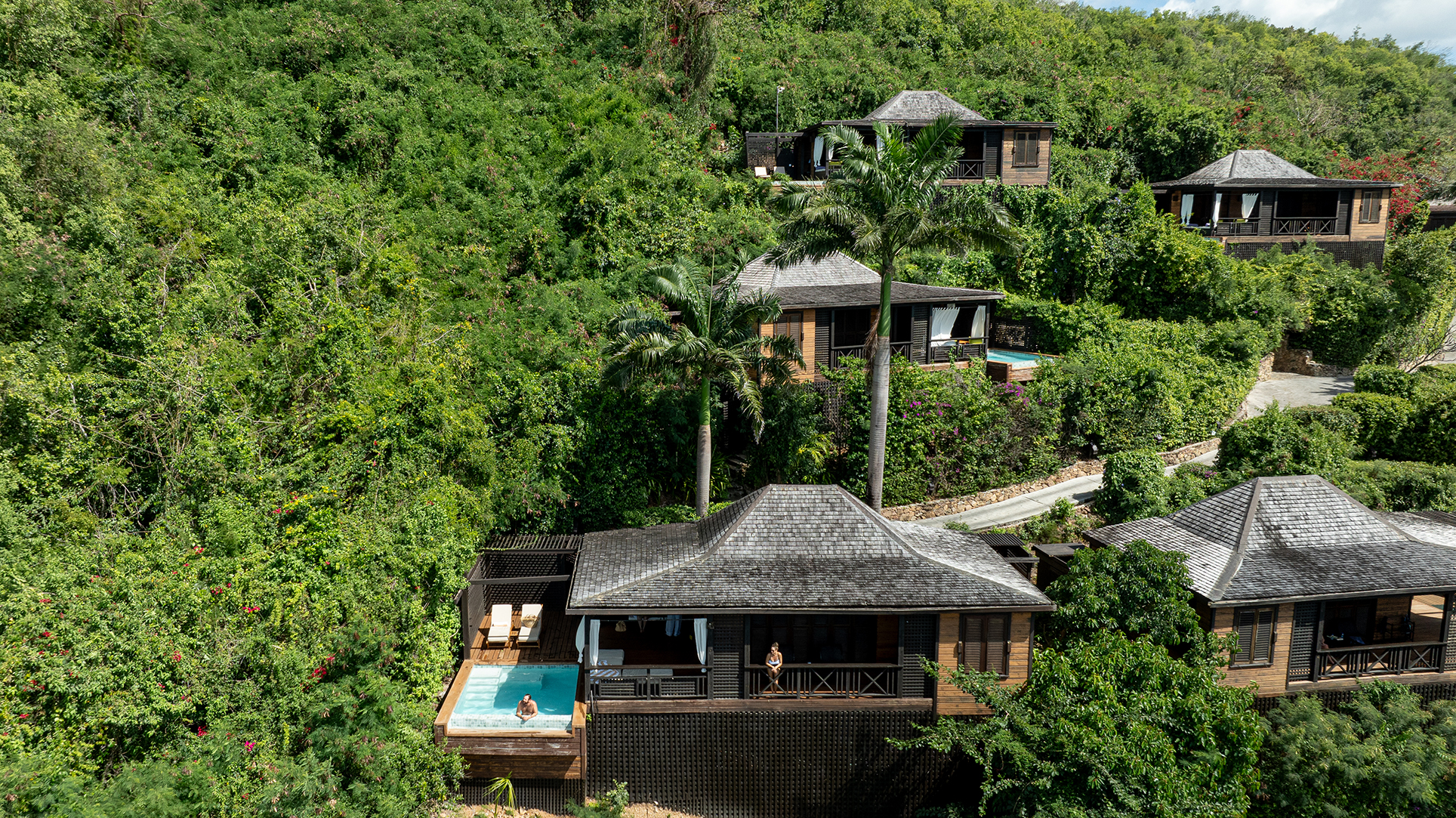 Caribbean & Mexico, Antigua, Hermitage Bay, exterior of villas surrounded by greenery