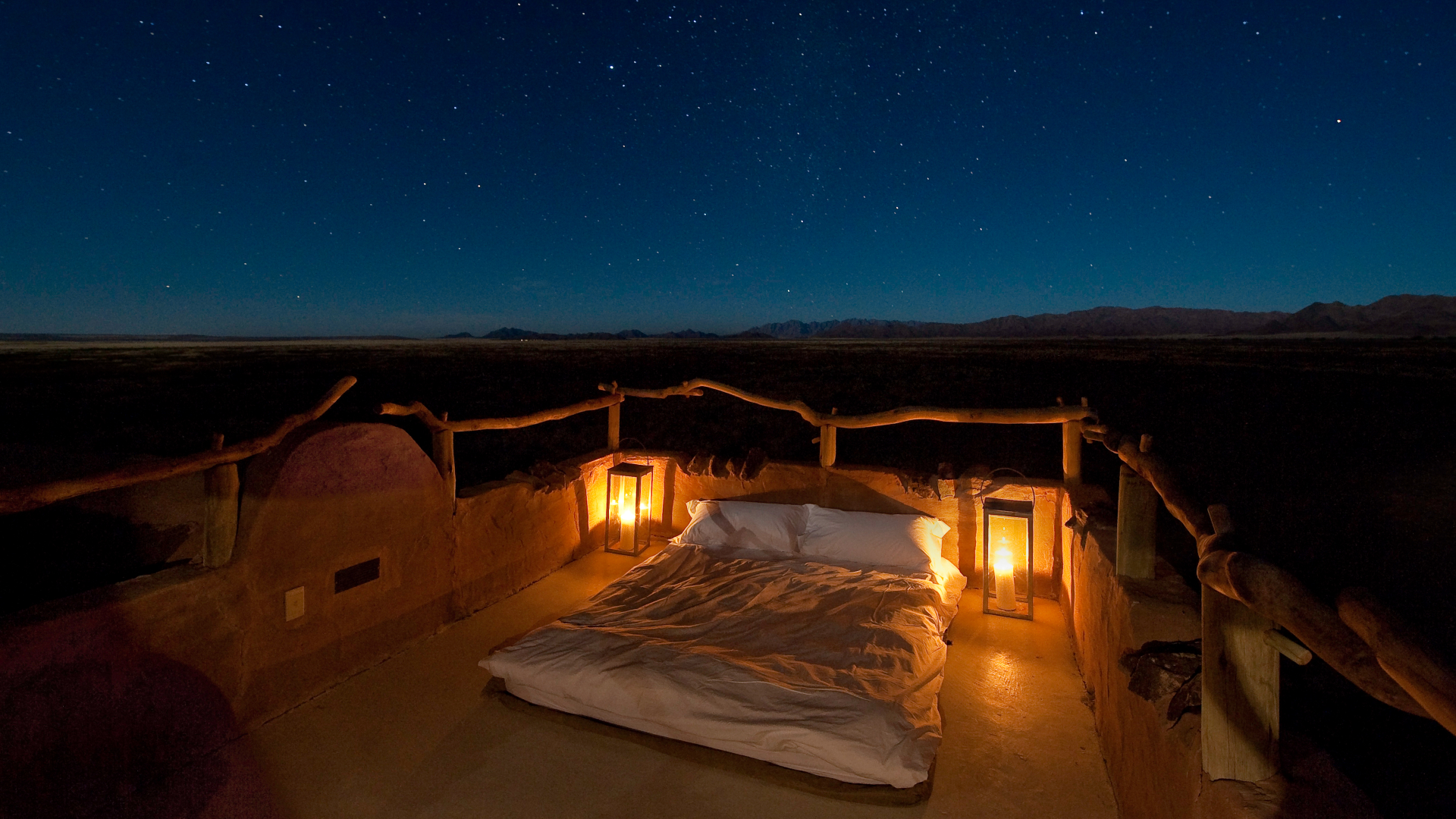 Africa, Namibia, Little Kulala, bed on private deck 