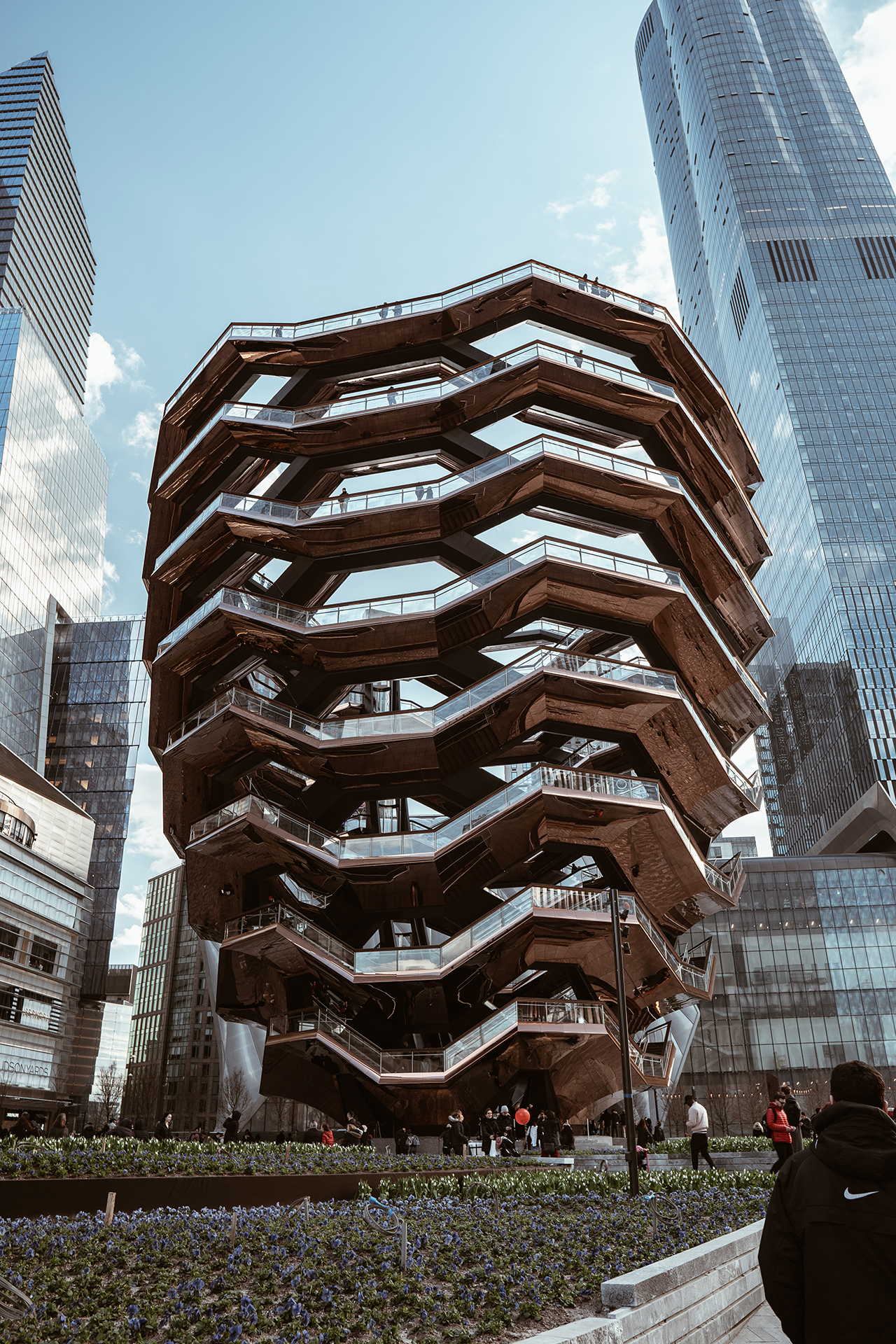 The tall modern Vessel building part of the Hudson Yards Redevelopment Project in Manhattan