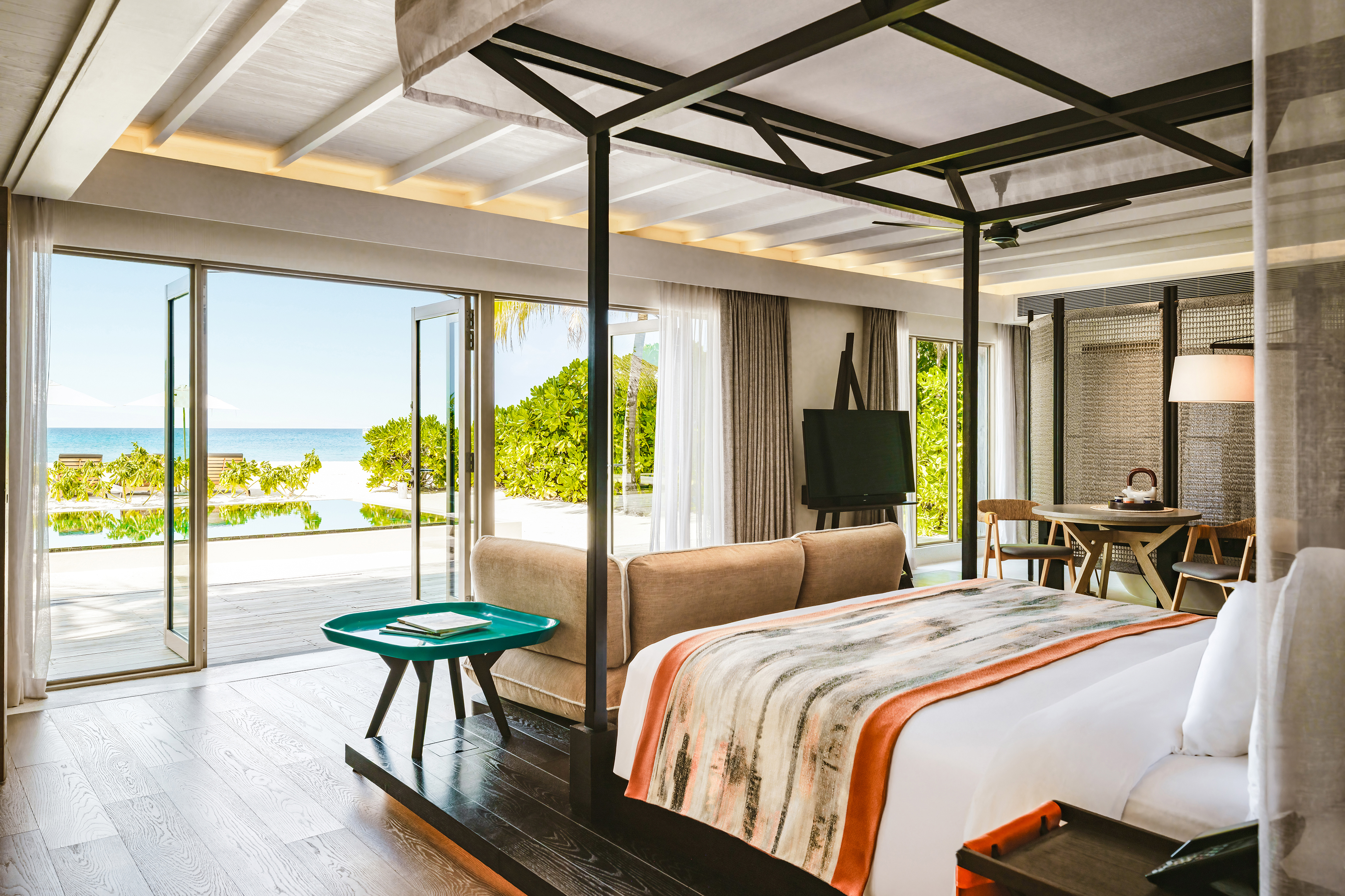 Luxurious beachfront villa at InterContinental Maldives with open-air ocean views and modern interior design.