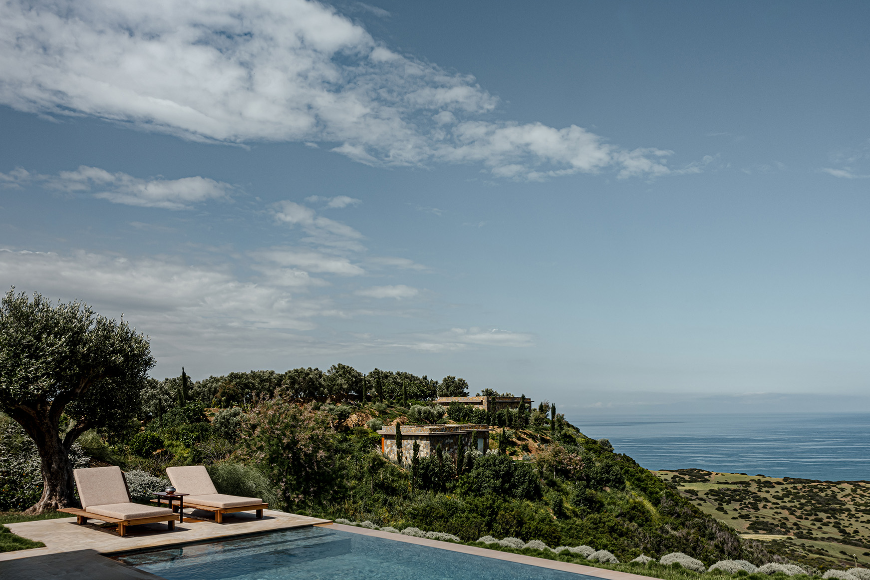 Africa, Morocco, La Fiermontina Océan, poolside sunloungers and a sea view