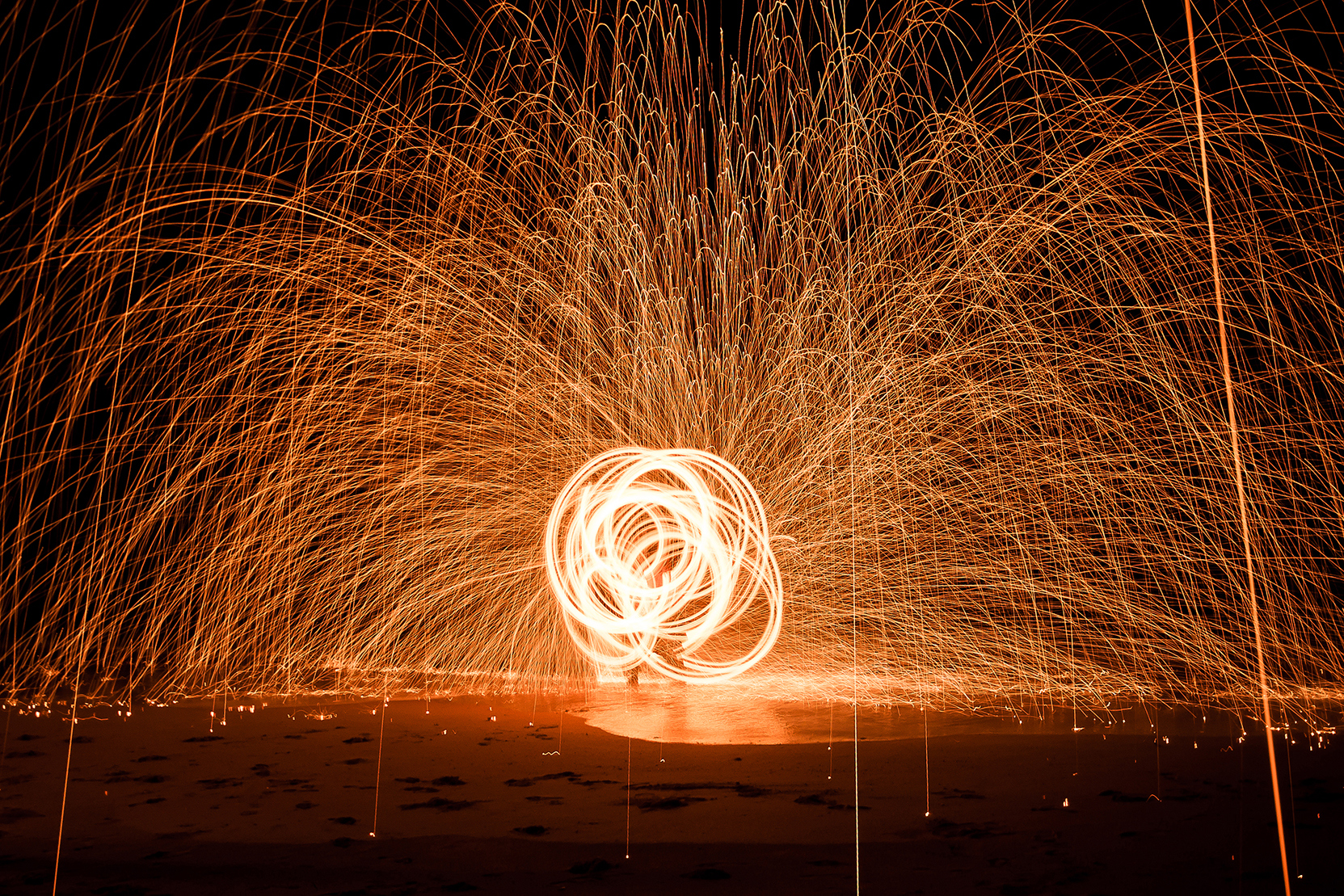 Long exposure shot of fire twirling artist on Koh Samui