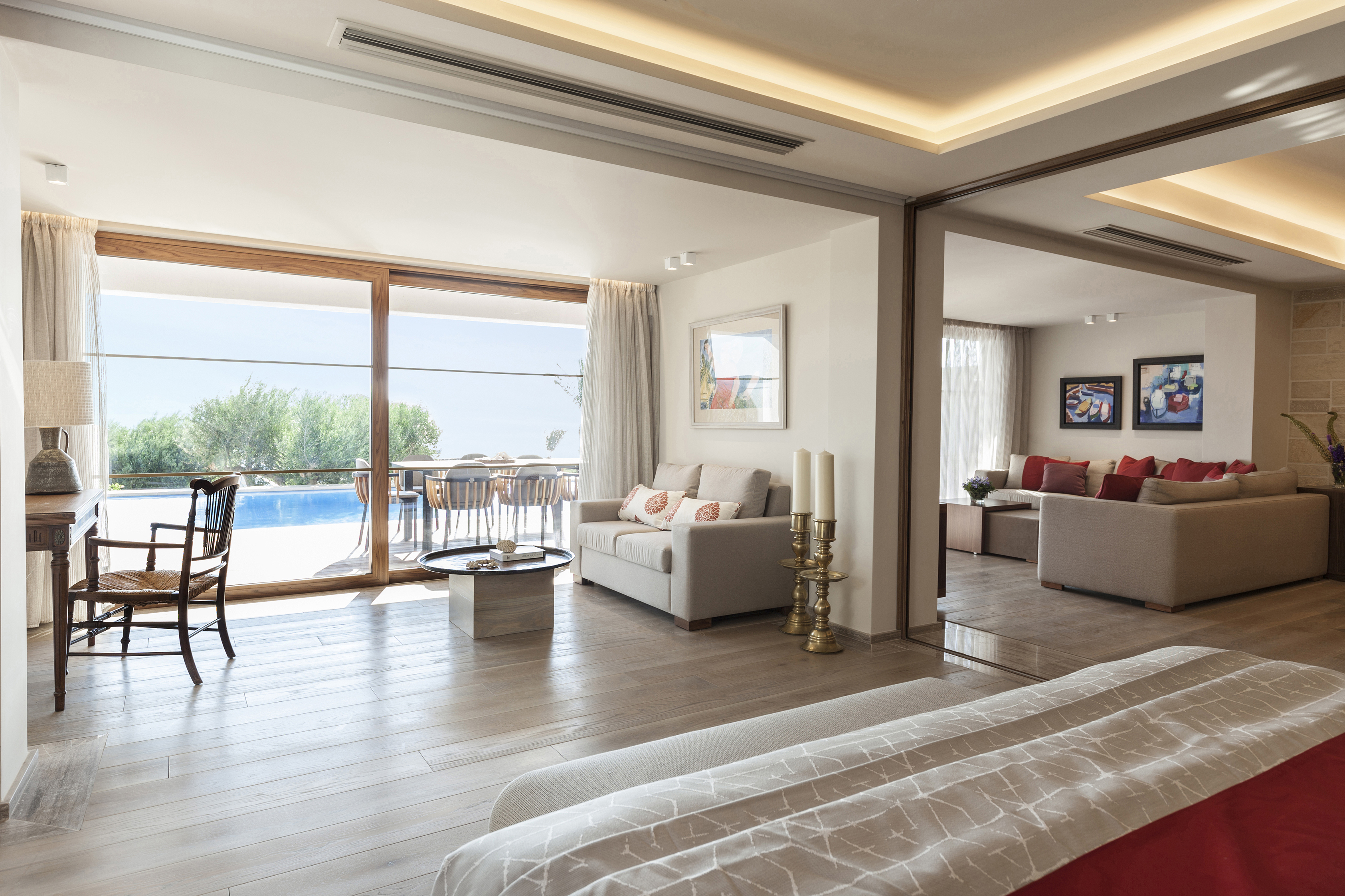 Lounge area of Minoan room with sofa and gold candles