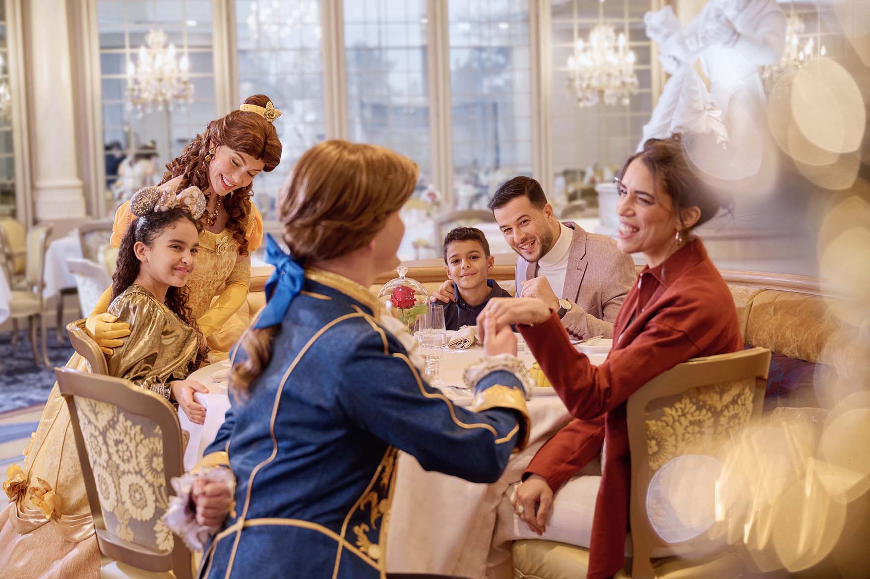 Europe, France, Paris, Disneyland® Hotel, Guests with Belle and the Beast at La Table Lumière restaurant